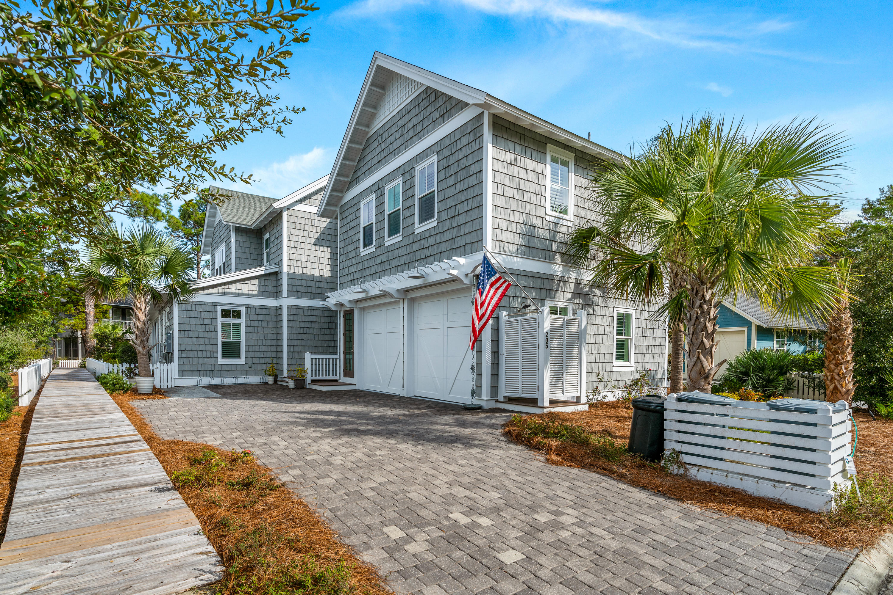 Beautiful 5 bedroom, 5 1/2 bath home located south of 30a in WaterSound West Beach! Masterfully built by Regal Stephens and immaculately well maintained, this amazing beach home is being offered fully furnished and is perfect for large families and entertaining guests! It boasts an open concept layout with a spacious living area, a large gourmet kitchen and a first floor master suite! The living area leads to an oversized wrap around screened porch that overlooks a nature preserve and comes complete with an outdoor gas fireplace and summer kitchen! Upgrades are numerous and include distressed hardwood floors throughout, Thermador appliances, honed marble countertops, Shiplap wall accenting, 10 ft ceilings, crown molding, built in bunks, frameless glass showers & plantation shutters. This thoughtfully designed beach residence flows seamlessly into the second floor and includes a generously sized secondary living area, an additional master suite, a spacious guest bedroom and a custom bunk room, all of which have full en suite baths and walk in closets for storage. The home is also wired for sound with multiple zones and includes a security system. In addition to the main home, there is also a carriage home that is located over the garage that has its own private interior entry. The carriage home is an ideal compliment to the main home and was designed to be fully functional with its own kitchen and living room as well as a private bedroom and full bath. Watersound West Beach owners enjoy access to multiple community boardwalks that meander through the community and lead to various green spaces, parks and the serendipitous community pool, which features an outdoor fireplace and grilling area.  The boardwalk near the pool continues south through a beautiful, natural preservation area that boarders Deer Lake State Park and leads to the deeded beach access for the community. Considered by many to be one of the most pristine and private stretches of beaches along 30a, this spectacular natural amenity is a must see for all potential home owners! Watersound West Beach owners also have the added benefit of being able to join the clubs at St Joe which include the Watersound Beach Club and the golf clubs at Camp Creek and Shark's Tooth. Schedule a private showing of this wonderful beach home today!