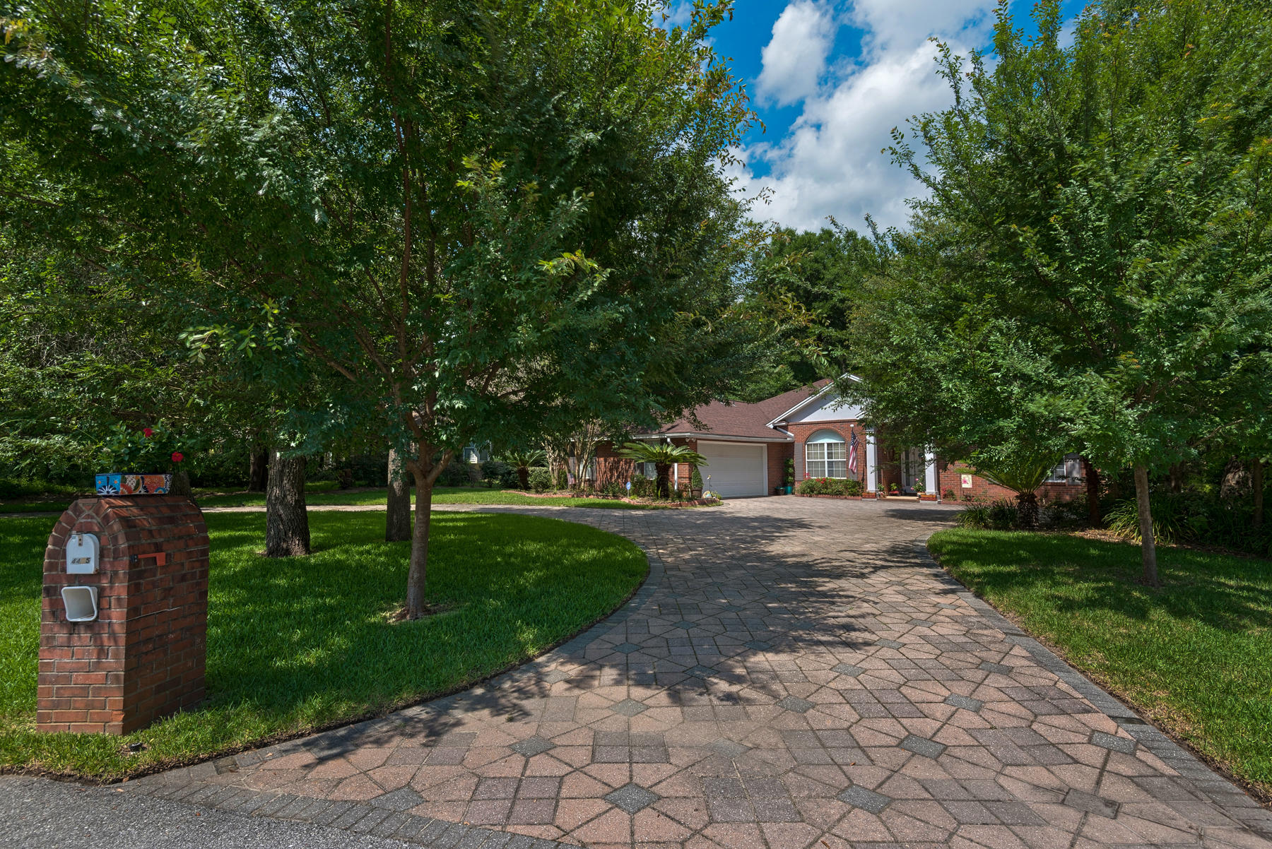 Ideally located on a quiet cul de sac in the Rocky Bayou area, this secluded southern style home is surrounded by nature, set among a private oversized wooded lot. The spacious landscaped yard backs up to Eglin Reservation, forever remaining private and undeveloped. This turnkey, move-in ready home has been meticulously maintained and includes a new water heater, new HVAC unit, and a new roof installed in 2015. Solid hardwood floors are found in both the living room and kitchen. In the kitchen, you will find stainless steel appliances and gas range outfitted for the chef in the family. Continuing into the large master suite, featuring a double vanity sink, walk-in shower with separate soaking tub. This master suite also features a large walk-in closet with built-in storage. In addition to the 3 bedrooms, this home also features both a Florida Room and Sunroom, providing additional heated and cooled living spaces. Enjoy the beautiful outdoor patio space, with private pavilion covered by live Oak. This home is a must-see!