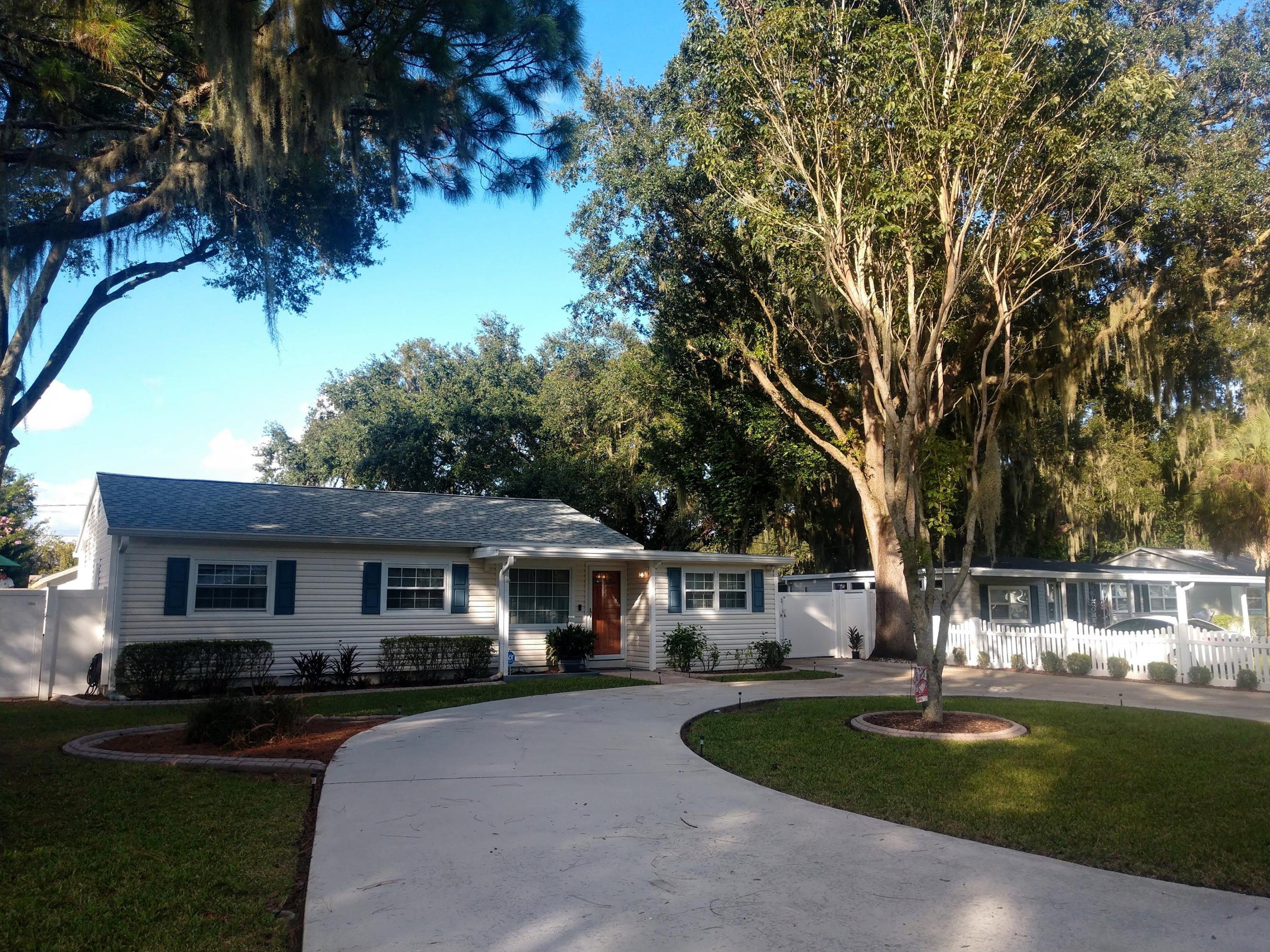 Prepare to fall in LOVE! This intown ranch is full of surprises that you don't want to miss. You'll easily imagine preparing dinner in the beautifully updated kitchen with solid surface countertops and generous storage. After gathering around the dinning room table, relax by the fireplace or TV in the inviting sunroom/living space. The sunny Florida days and balmy nights are a welcome excuse to entertain in your professionally landscaped backyard oasis. A dip in your small, private pool will wet your appetite:) A custom built pergola, complete with outdoor kitchen, grill, smoker and TV are made for your favorite movie and sports gatherings! A place for RV parking, additional concrete pad parking and LARGE shed storage are all behind the privacy fence that encompasses the backyard. NEW Roof A NEW roof in August, new luxury vinyl plank floors, new A/C in March of 2016, a whole house Rain Soft System, ADT security and Ring doorbell are also bonuses with this property. Come take a look for yourself. This one won't last long!
