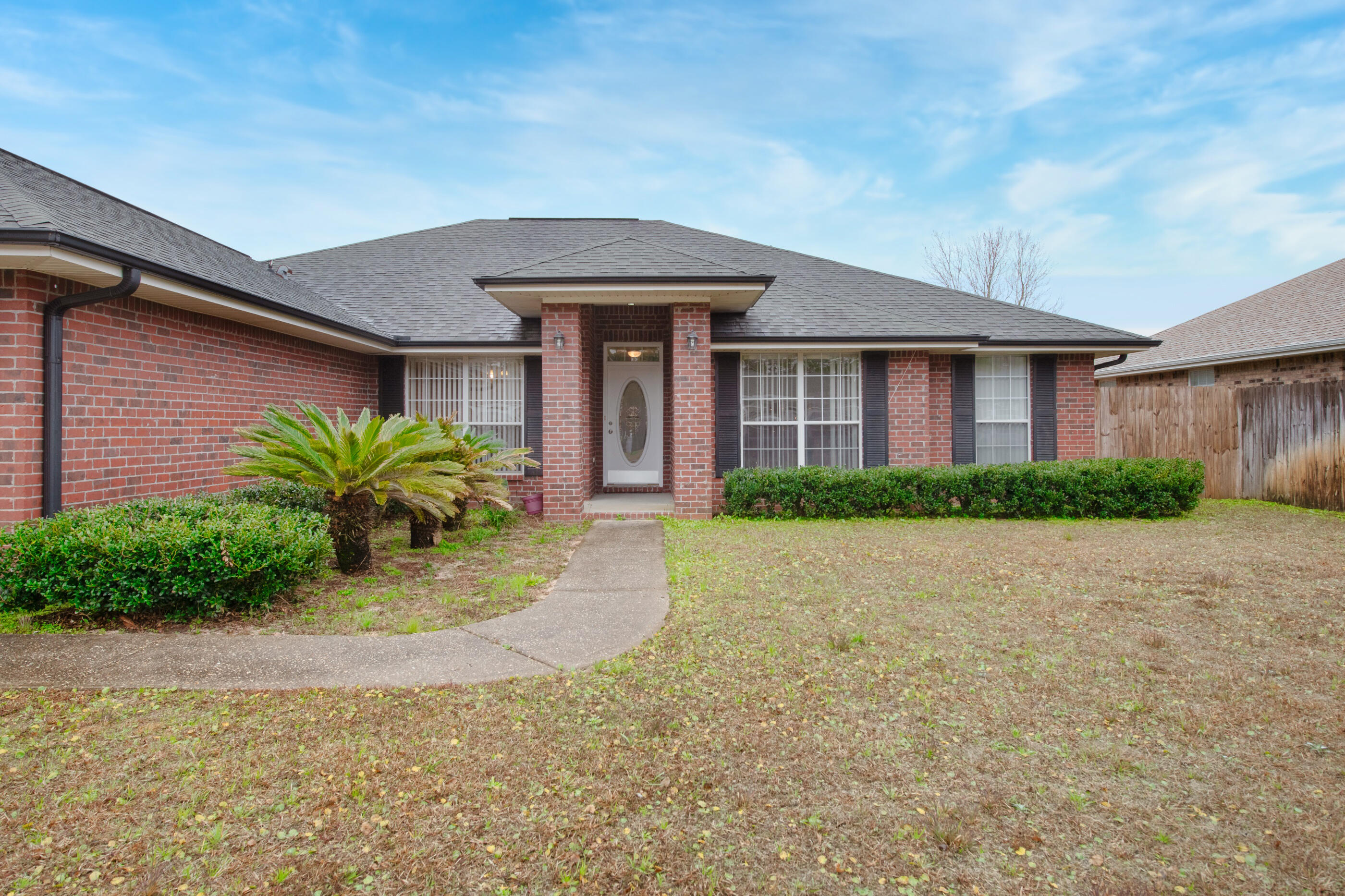 Back Up Offers Being Accepted! Welcome home to this fresh take on 2022! Such a perfect location just far enough from 98 to lose the traffic noise, but easy access via a light.  No HOA! East end of Navarre makes your commute easy!  This fabulous neighborhood home has fresh paint and flooring. The ever-popular split floorplan lines up the large en-suite master behind the great room, and the three spacious bedrooms reside behind the kitchen area. Very roomy closet space!  Fireplace, dining room AND a Den, covered screen porch, and fenced back yard.  Living space galore in this one.  Roof 2004, HVAC 2016, Water Heater 2012. Seller will add new roof with a great offer!!