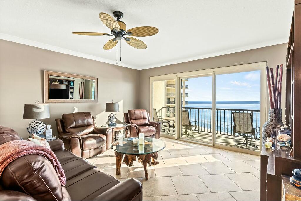 Elegant turn-key gulf-front unit in the premier, gated, non-rental condominium community of Summerwinds. This fully furnished unit includes kitchen dishes and cookware, making it perfect for either a private residence or a second home. The unit is well-appointed with tasteful furnishings, fine finishes, and 9-foot ceilings. It features an open living and dining area with panoramic Gulf views from both the living area and the master bedroom. The master bathroom has been completely renovated, and new carpet has been installed in both the master and guest bedrooms. For added convenience and security, the unit is equipped with motorized hurricane shutters that are easily operated by remote control. An assigned enclosed single-car garage space (E4) is included. This unit is not to be missed.