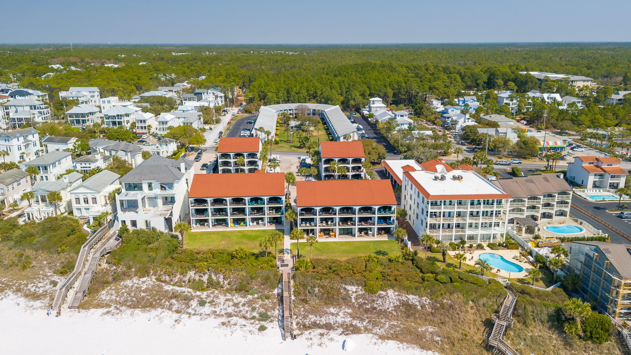 Welcome to your perfectly placed beach escape on 30A. This beautifully updated, low density condo is ideally located on the beach side of Scenic Highway 30A, meaning no busy road crossings and your deeded beach access is literally right in your backyard.

Lovingly maintained and thoughtfully redesigned, this one bedroom retreat includes hallway bunks and a sleeper sofa, comfortably accommodating up to six guests. The hallway bunks were reimagined for improved comfort and easier accessibility, making the space feel more open and functional for families and visitors alike.

Inside, you'll find luxury engineered vinyl plank flooring throughout, creating a clean coastal feel that's both durable and stylish. Both bathrooms feature tub and shower combos along with newly updated sinks, vanities, and fixtures for a fresh, modern finish.

The kitchen has recently undergone a major renovation with new cabinetry, quartz countertops, and select updated appliances, offering an elevated look and feel that's ready for hosting, relaxing, and everything in between.

Step out onto the balcony overlooking the pool, perfectly positioned with a southwest facing view that delivers some of the best sunsets on 30A. Whether you're starting the morning with coffee or winding down after a day on the sand, this is a view you'll never get tired of.

Located at The Palms of Seagrove in the heart of Seagrove Beach, you're just a short stroll or bike ride to local dining favorites and the iconic charm of Seaside. If you've been searching for a turn key beach getaway, second home, or investment opportunity in one of 30A's most desirable areas, this is the one.