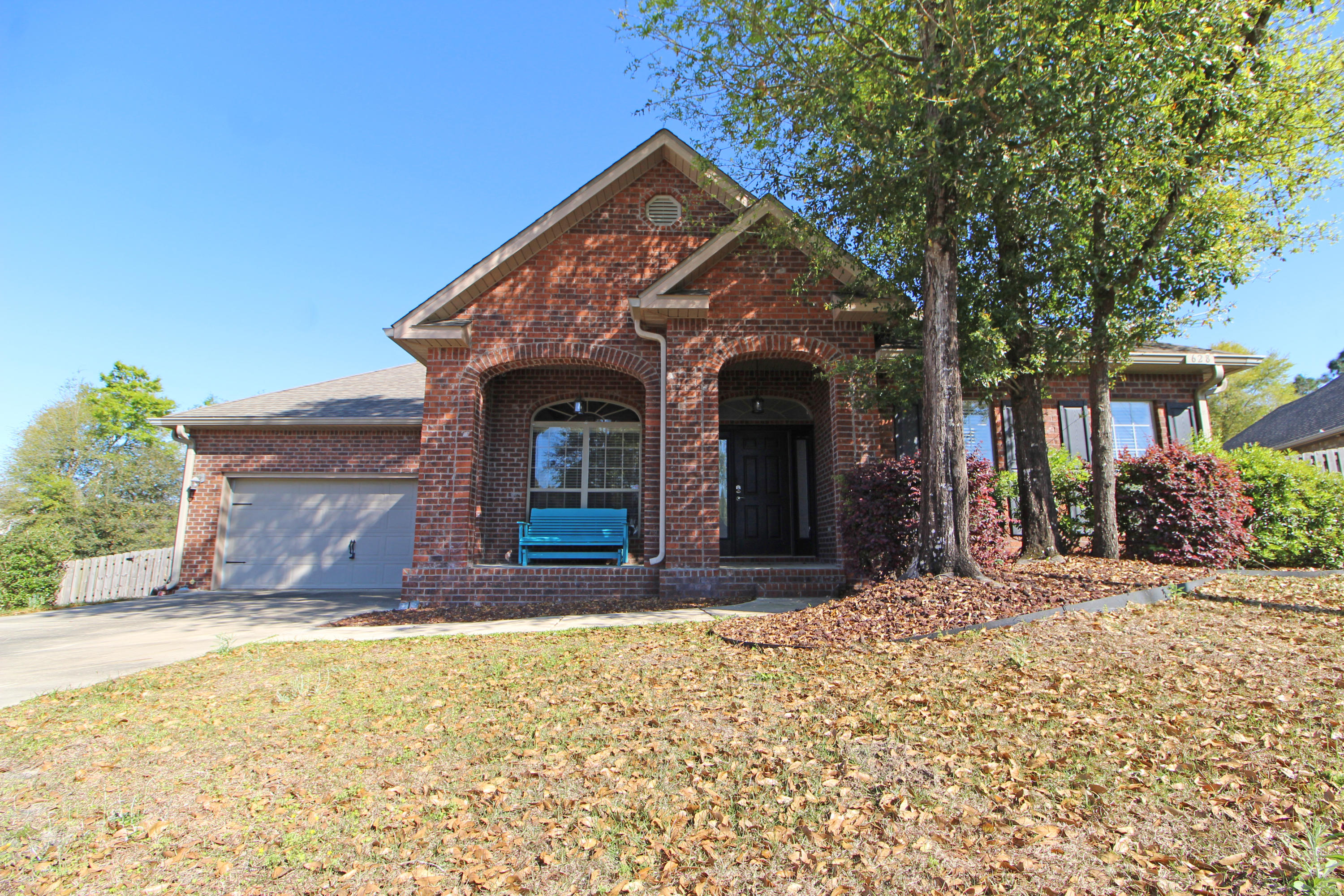 Gorgeous 5 bedroom, 3 bath home on HUGE lot in Fox Valley, South of I-10! You'll be amazed by how large this home feels when you walk in! Welcoming and well sized entry hall, formal living and dining rooms, fireplace with custom stone inlay above mantle, high ceilings, arched interior entries, granite throughout kitchen and ALL baths, stainless appliances. Kitchen has both a center island and breakfast bar, custom tile backsplash, and under-cabinet lighting. Home features include a security system with sensors on all openings to outside and even a tankless water heater. The screened porch has a ceiling fan and TV mount. Enjoy some tunes while you gather 'round the fire pit or swim in the pool, or take the kids to the community playground! Too many extras to list! Call today to take a look!