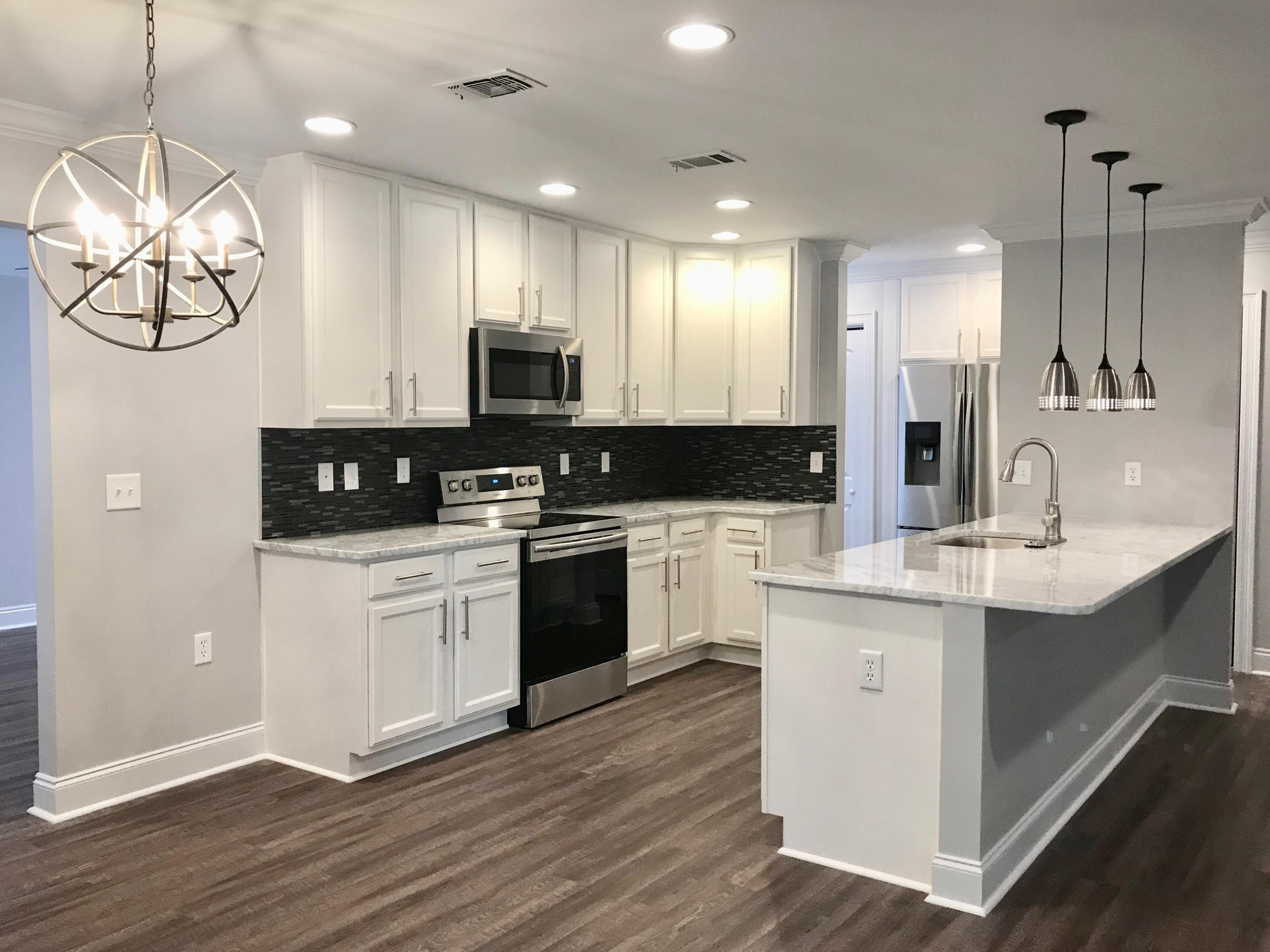 Completely renovated home and this beauty shows like brand new! High end finishes include new flooring (no carpet in this home), crown molding and recessed lighting. Kitchen has all new stainless steel appliances, marble countertops, brand new cabinets, over sized island with pendant lighting and two pantries. Renovated bathrooms with new cabinets, marble countertops and double vanities. Open floor plan features kitchen, dining and family room with fireplace just perfect for entertaining. Home also includes separate living room and heated/cooled Florida room overlooking private, fenced backyard. Brand new architectural shingle roof, sod/landscaping and irrigation pump. Great location close to schools, shopping and dining. Buyer to verify all dimensions.