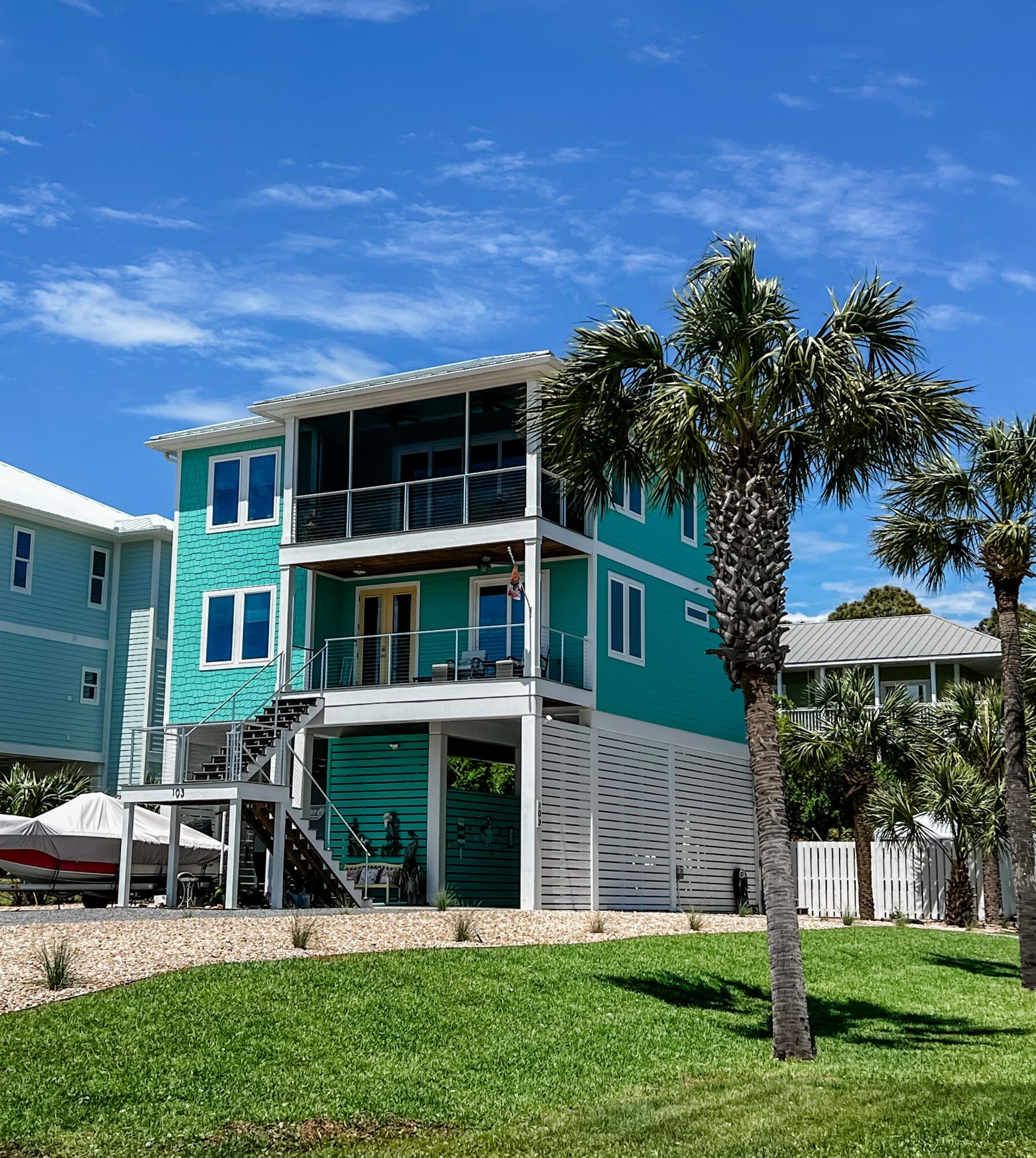 There are 1st tier luxury homes with unobstructed views of the Gulf of Mexico and then there is this turn key and fully furnished beachside gem! So many extras, we needed an amenities list. Completed in 2022 and never rented, this 4 Bedroom, 3 bath home was designed for entertaining and beachcombing. Delightfully appointed inside throughout with a nautical flair that flows to an outside pool, spa, and bar entertaining oasis. Built by one of the premiere builder in the area, Pepperfish Construction, the custom details inside and out are apparent in the details. GROUND LEVEL consists of; beautiful xeriscaped/ palm accented corner lot, 8+ parking spaces, double concrete and covered bays, one high enough for boat/RV storage, RV water and sewer hookup, 400 amp service, Generac for entire house storage shed, and louvered trim. The heated pool and spa are large w 1200 sq ft of brick pavers, polywood furniture, 1000 gal in ground propane tank 1ST LEVEL consists of the master Ensuite that has a private access to a lovely balcony. Master bath has a double vanity with granite countertop, custom tile shower, and a walk-in closet. Across the way are two spacious bedrooms that are connected via a Jack and Jill bath that also has double vanity with granite countertop as well as a custom tile shower. Additional space consists of a beautiful foyer, balcony, laundry room, and elevator access. 2ND LEVEL is an entertainers delight with an open area that consists of a custom kitchen with a propane gourmet stove and range, custom cabinets with granite tops, large kitchen island/bar for extra seating. Separate dining area with seating for 6 as well as a beautiful custom trifold barn door pantry. A well appointed great room that empties onto a screened in balcony with stunning views of the Gulf of Mexico. A bonus bedroom/office and full bath with Tile shower and granite top vanity. Per owner; Salinas Park access for golf carts via the subdivision. Please see attached amenities list.