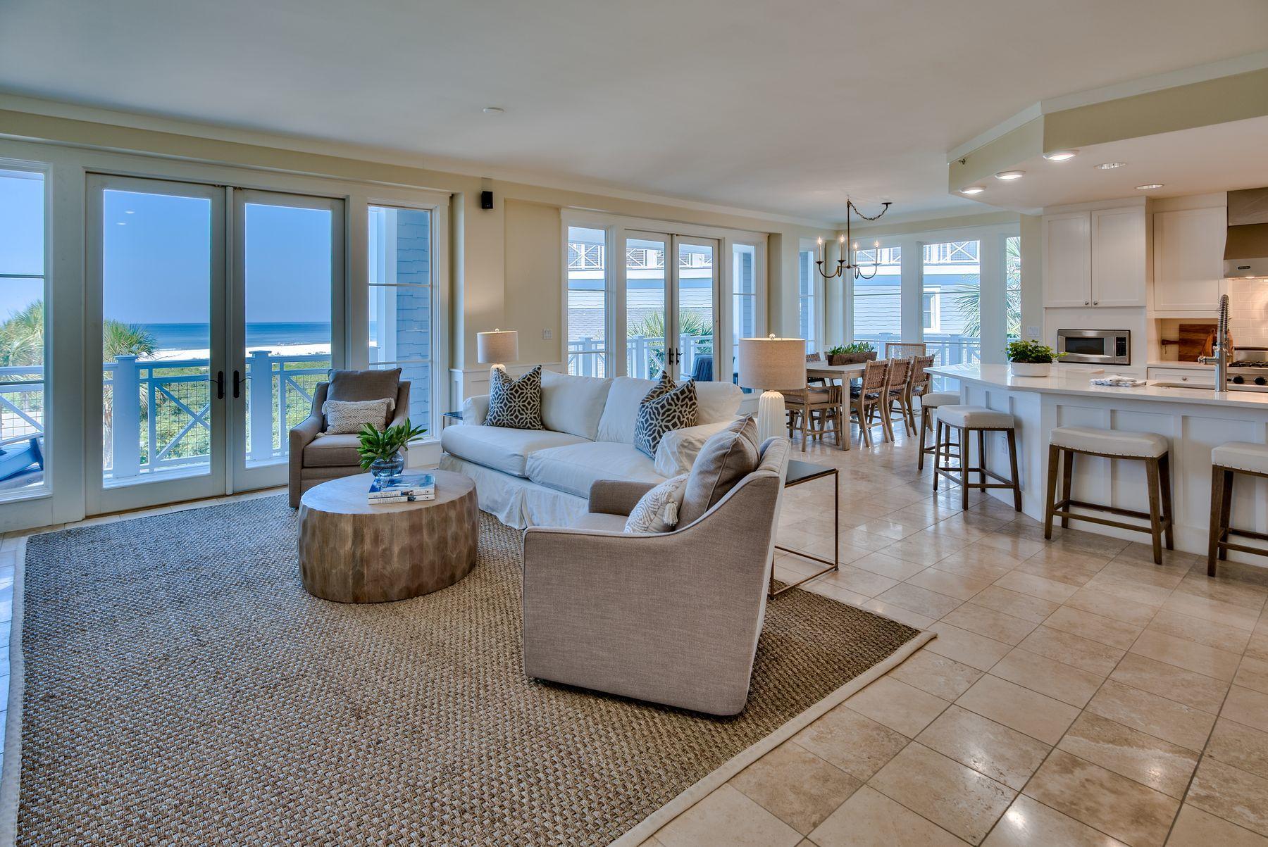 Move into this newly renovated three-bedroom condo in WaterSound Beach and enjoy all the benefits of this exclusive gated community. Accessed by elevator, this coveted corner end unit has a wraparound balcony delivering breathtaking gulf views with a choice of sunshine and shade at all times. Laura McKee of Dwell Interiors has weaved her magic with alluring new furnishings, handpicked artworks, rugs and home accents all included in the sale. Three bathrooms have also received an update to complement the soaking tub, beautiful tiles and modern vanities. The open plan living room is a spacious area for relaxing and entertaining. Throw open the double sets of French doors and enjoy the gentle sea breeze and glorious views across the dunes and Gulf of Mexico. Tile floors extend to the corner kitchen with its breakfast bar for casual dining. Newly upgraded, it is a well-planned space with new countertops, designer lighting, stainless appliances and fresh paint. Awaken each morning in the spacious master suite which has its own private balcony for peaceful morning views overlooking the sparkling emerald waters. The ensuite guest room and furnished bunk room for four make this an attractive condo for vacation rentals. Days will easily be filled with a visit to the WaterSound Beach fitness center or strolling the full mile of pristine white sandy beach. There's a dog park, puttering green and a children's playground, all connected by seven miles of meandering, traffic-free boardwalks and bicycle trails. Take a swim in the community pool nearby before heading for lunch at your favorite café on Scenic 30A. Deer Lake State Park has endless outdoor activities including kayaking and paddle boarding while nearby Alys and Rosemary Beach offer shopping, dining and entertainment.
