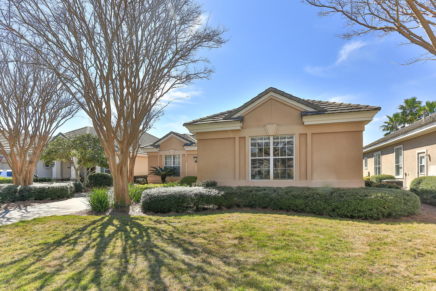 Beautiful views over a lake to the 14th hole of Kelly Plantation Golf course. This home in Carriage Place has 3 Bedrooms / 3 Bathrooms along with a Media Room/Office which could serve as a fourth bedroom. Large eat in custom kitchen and separate dining room that opens to the great room. Relax in the private swimming pool. With picturesque views and an open floor plan, this home would be great for entertaining! The HOA dues for Carriage Place includes lawn care. FLOOD INSURANCE IS NOT REQUIRED! FLOOD ZONE X.