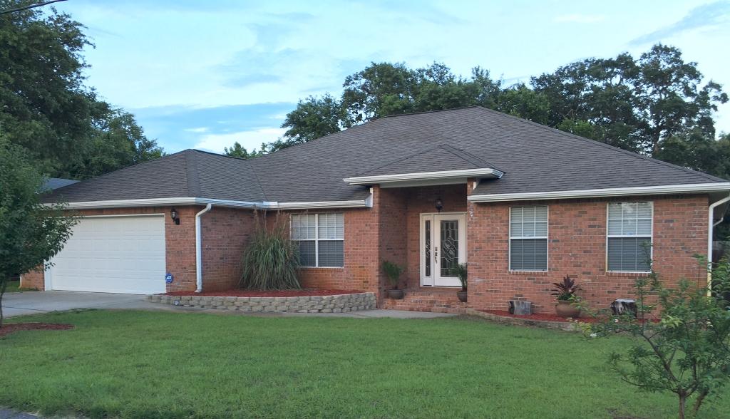 HEAR YE, HEAR YE, MOITVATED SELLER, WILL ASSIST WITH CLOSING COST! Yes, come and see Attractively Planned Home, 2 miles or less from Hurlburt Field AFB main Gate. Since A Great Location Isn't Everything, Look What Else you Get: A 2500 sq.ft., Well Maintained, All brick, 5 bedroom, 3 full bath home with unique desirable split floor plan.This home has 10 ft. Ceilings in Foyer entry way, and the Spacious Living room with adjacent Sitting area great for a library or for the kids enjoyment and indoor fun. French double doors off Foyer opens to office /Study/Den/or 5th Bedroom that's perfect for the large or growing family. Next to Dining Area that could hold complete Dining set is your dazzling, Stainless Steel, fully appliance Kitchen with ample counter and cabinet space any Chef would love. Split floor plan gives the feel of an oasis for both you and the kids or guest. Master Suite privacy bathroom design has Custom Built Shower, and huge Walk-in Closet. All bedrooms are nice sized bedrooms, featuring a Jack & Jill full bath between bedrooms 3 & 4, and a full bath off bedroom 2 that's idea for Guest or Mother-In-Law quarters. Has a  roomy laundry room w/built-in wash tub adjacent to finish double car garage w/garage door opener. Other extras includes: Tile flooring in Foyer, Living/Family room, Kitchen and remaining wet areas, laminate wood flooring in all Bedrooms, Faux wood blinds window treatments, satisfying closets/linen and closet space. Ceiling fans thru-out. Glass pane French double doors off Living/Family room/Sitting/Library area leads out to open wooden deck great for relaxation on those lazy days and BBQs get-togethers. Home has sodded, privacy fence back yard that has sprinkler system w/automatic timer. Yes,the PERFECT Home for a growing family. Don't delay, Call today! Real nice. . . .