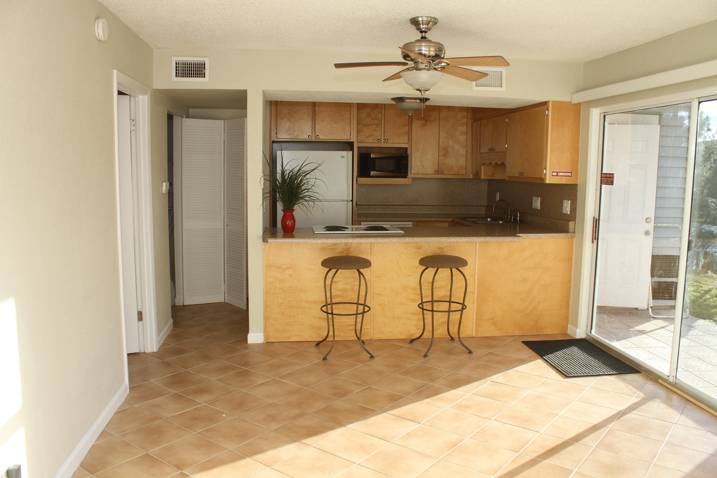Charming one bedroom condo. Easy access first floor with a view of the Lake. Updated - kitchen, all appliances newer, breakfast bar, recessed lighting, ceiling fans. Tile through-out, freshly painted, includes washer & dryer. a must see to appreciate the upgrades. Community offers 3 pools, tennis, onsite - outdoor grills, Lake stocked for fishing, Close to Beaches, Shopping & Entertainment. Buyer to verify all dimensions.
