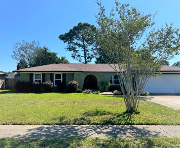 Location.. Location!! In Eau Claire Estates which is just minutes away from Shopping, Restaurants, Colleges, Malls, Airport, Hospitals, and I-10. This ALL BRICK 3 bedroom 2 bathroom with a 2 car garage.  Has been transformed with beautiful updates ...LVP Flooring throughout, Tile in Bathrooms. New Windows, New Ceiling Fans, New Light Fixtures, Gutters, Fresh Paint Inside & Outside Home. Large Living Room. with a separate Spacious Family Room great for entertaining family & friends enjoy stepping out the Double GLASS Doors into the Fully Fenced YARD with a beautiful Magnolia Tree. KITCHEN has a Solid Surface Counter tops with Double Sink, Appliances, plenty of cabinets for storage. Large LAUNDRY ROOM. Hurricane Shutters and Extra Flooring in Garage.  ***Home Warranty Included!