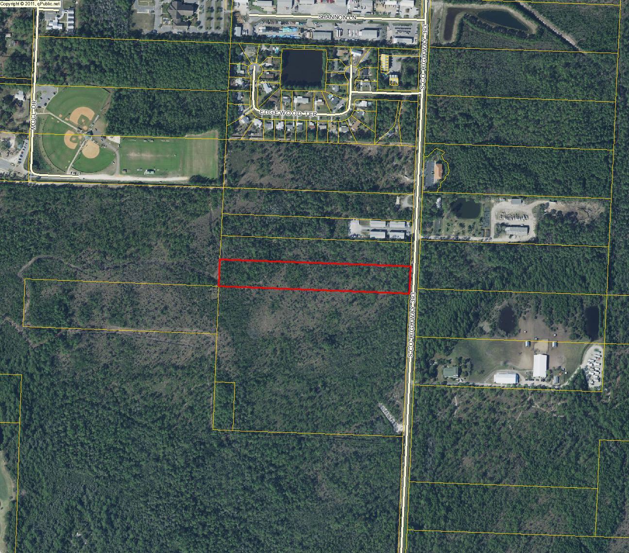 Zoned NPA infil, south of Hwy 98, fronts on hwy 393 and has some commercial uses. 160 front feet on hwy and 1320 deep. Approximately 1.4 miles from beach.