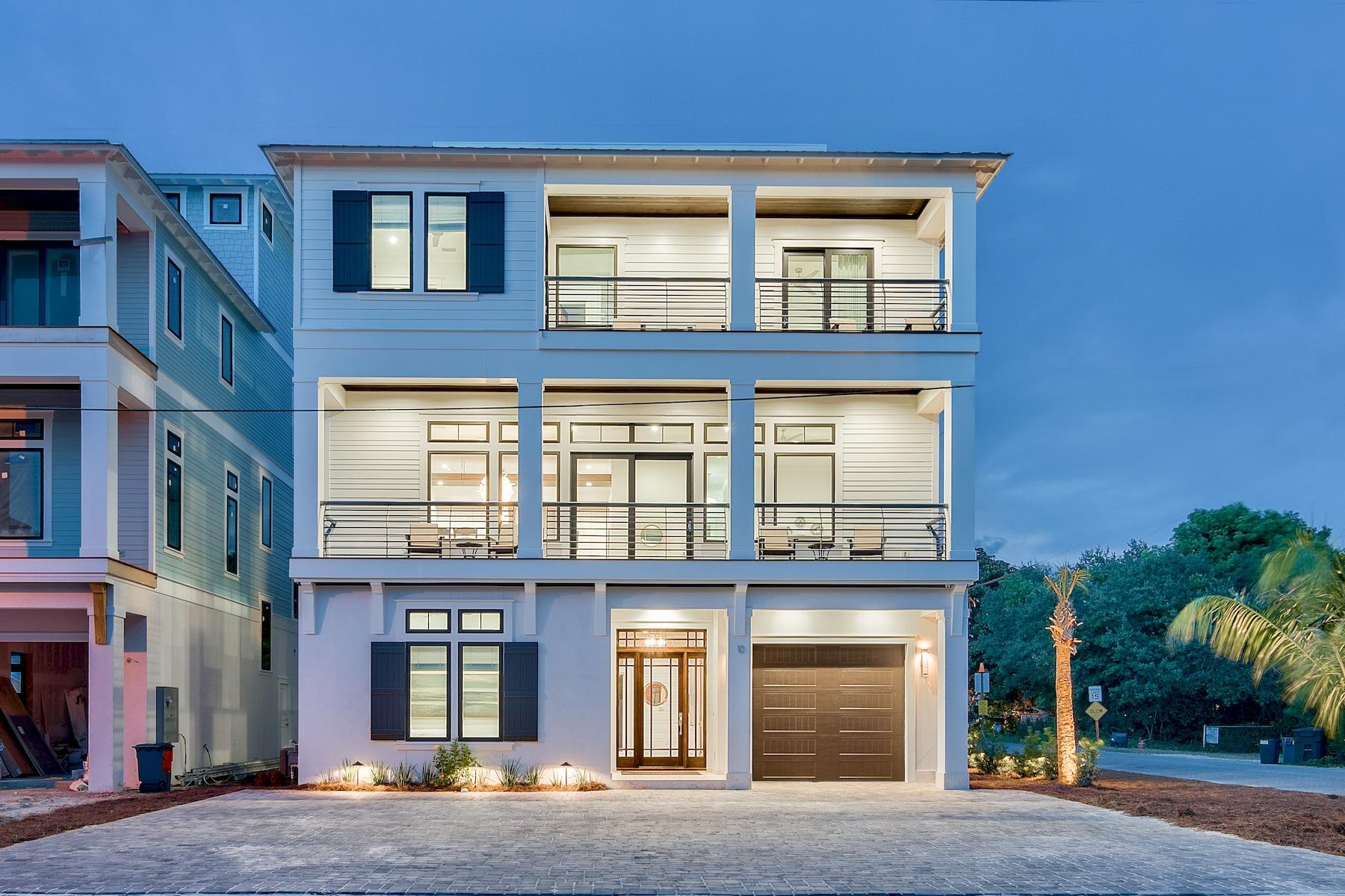 Sleek coastal contemporary design perfectly situated to capture gulf views & masterfully configured providing unparalleled amenities including a Watermark-built private resort style pool area complete with a covered outdoor summer kitchen. This is the ultimate beach house, an excellent income producer with $250,000 in gross projected annual rental income. This home was designed to maximize functionality and finely appointed with chic contemporary finishes while affording optimal comfort & living space. Notable features include multiple indoor and outdoor living areas, private commercial grade elevator, dual master suites with gulf views, built-in pinterest worthy bunkbeds, indoor and outdoor surround sound system as well as security cameras for optimal privacy. The first floor layout boasts a spacious bunk room, full size laundry area, large bedroom with ensuite bath as well as an industrial style game room complete with a pool table & built in wet bar including a full size paneled fridge and refrigerator drawers flowing seamlessly out to the rear pool deck and covered outdoor living area. The second floor is the focal point of indoor living space with a sleek contemporary living room featuring floor to ceiling windows to soak in natural light & gulf views, built-in entertainment center with floating shelves and open to the kitchen & dining room for optimal flow. The ample sized kitchen features floor-to-ceiling custom contemporary cabinetry, Sub-Zero appliances and Wolf professional series gas range, ample storage and is anchored by a massive center island crowned with gorgeous quartz countertops. The second floor also features two full bedrooms with ensuite bathrooms, convenient half bath as well as access to the second story outdoor dining area overlooking the lagoon style pool. The third floor features three full bedrooms including dual master suites with spacious porches, laundry area, bunk room as well as a fourth story viewing deck to maximize the incredible gulf and western oriented views that surround this prestigious home. Frangista Beach owners enjoy multiple deeded beach access points steps from the home and centrally located near world class golfing, dining, shopping & entertainment.