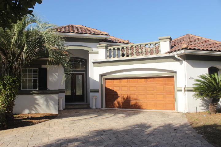 This 3 bedroom, 3 bath REO home just needs a little love to make it your dream home. What a great opportunity to own in Regatta Bay! The front doors lead to a court yard with a pool, spa and outdoor kitchen. The 3rd bedroom is actually a Mother-in-law suite with a kitchenette, bedroom and bath. The home features gorgeous granite countertops, tile floors, a family area next to the open kitchen, a separate formal living area, trayed ceilings, a gas fireplace, a great office overlooking the pool and a split floorplan! Off the open and bright living area is a screened porch looking over the 4th fairway. The location is perfect, close to all the amenities Destin has to offer!