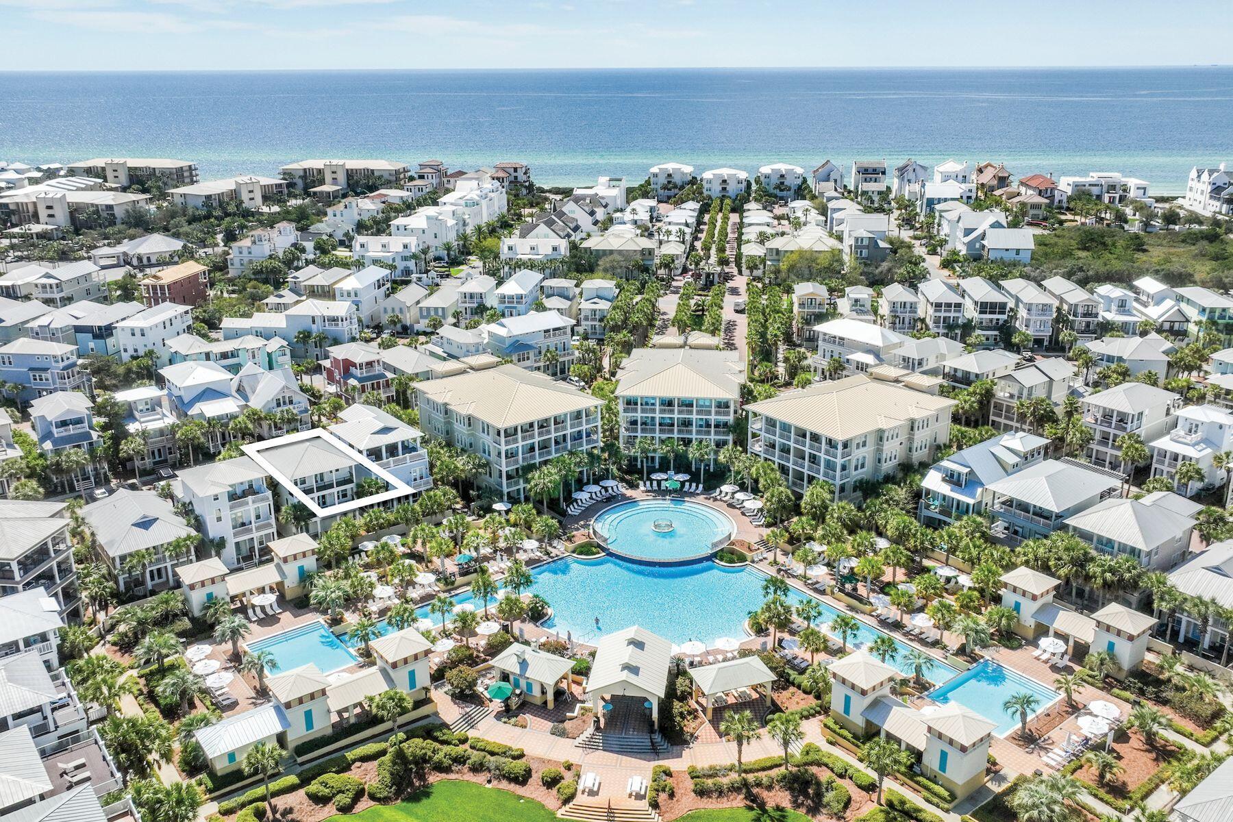This spacious five-bed, four-bath beach house is superbly located overlooking the 12,000-sq.-ft. lagoon pool in the heart of Seacrest Beach.  With a little updating, this property could be a great investment for rental income or just to enjoy with family and friends. Balconies on the upper floors allow everyone to find their own quiet space. The second-floor has an inviting open kitchen, dining and sitting area for gathering around the TV for movie nights, board games or leisurely dining. Extra guests can be seated at the adjoining breakfast bar, perched at the kitchen island or dine outdoors on the balcony or patio. The kitchen is fully equipped for preparing meals and snacks for hungry diners after a fun-filled day at the pool or beach. Head to the third floor terrace for sunning, sunset drinks or stargazing in the gentle sea breeze. This beautiful private haven looks down on the surrounding community. Bedrooms include two master suites, one on the second floor with a private balcony and ensuite bathroom, and the other on the third-floor with ensuite bathroom and attached bunk room which leads out to a peaceful balcony overlooking the pool. An additional first-floor bunk room shares a Jack-and-Jill bathroom with another bedroom with both having pool views and private patio leading out to the pool area. This well-located home has ample parking on the paved driveway and in the two-car garage which also provides storage for beach chairs and pool toys. There's a paved patio for barbecues at the rear of the home. Conveniently close to deeded beach access and tram stops, this spacious residence is at the front of the development making walking or biking to the renowned shops and eateries along 30A a breeze. Enjoy walking paths throughout the neighborhood and designated green spaces for pets, bocce ball, reading, or play areas for children as well as outdoor entertainment, farmers markets, and many amenities at Alys and Rosemary Beaches. This home offers the perfect blend of luxury and convenience.  Buyer should verify all data and dimensions if important.