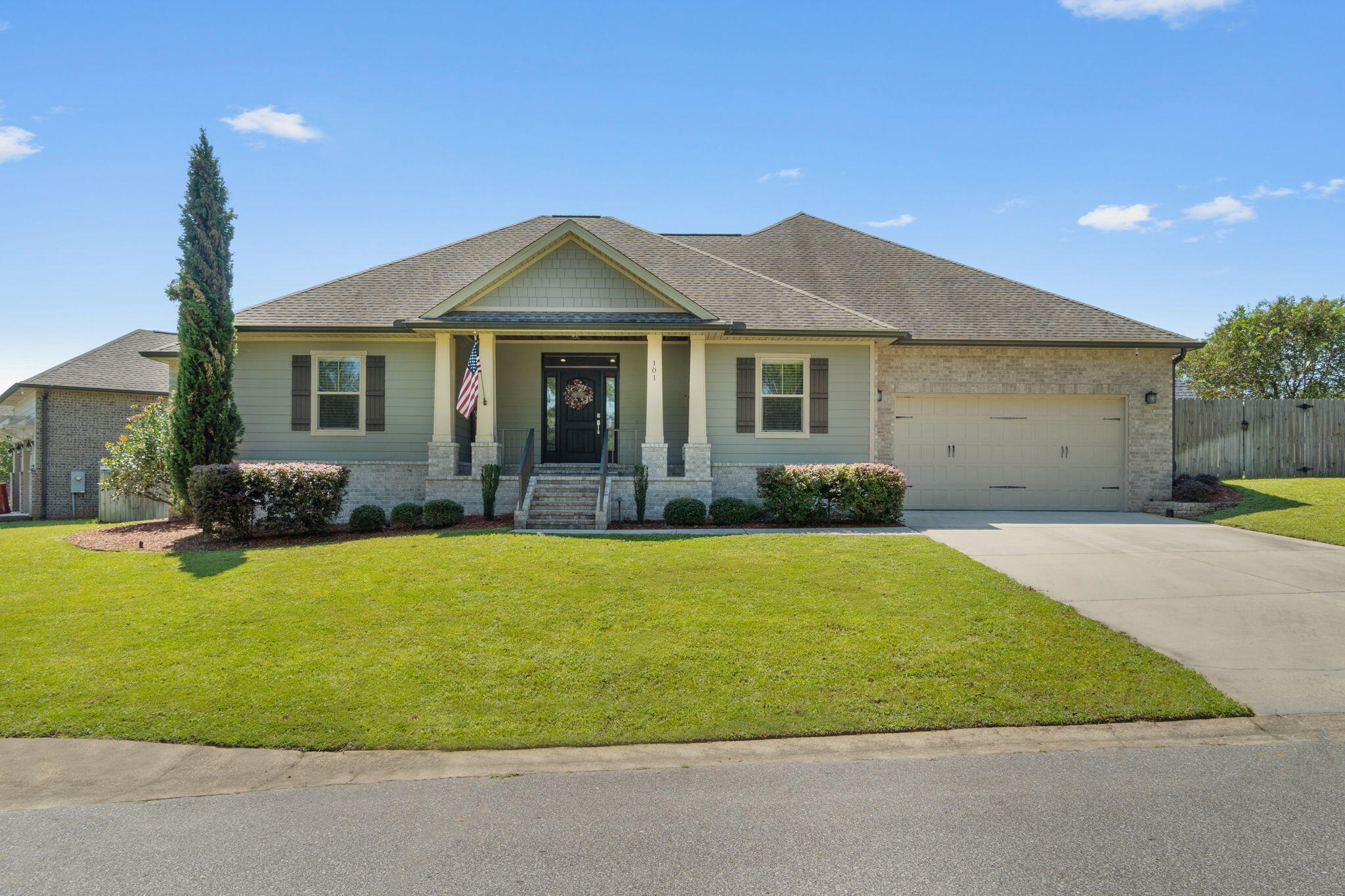 Welcome home to this absolutely stunning south Crestview custom home built by Wilson Enterprises, NWFL. This Parade of Homes winner is full of upgrades throughout and features 4 bedrooms and 2 bathrooms PLUS an additional office/media room. Pull into driveway and appreciate the brick and hardiboard craftsman style exterior, and walk up the brick stairs to find a gorgeous covered front porch with a wood ceiling. Inside you'll love the open floor plan with wood look tile throughout   and the shiplap wall entry. The living room features a vaulted ceiling with recessed LED lighting, a gas fireplace, and surround sound, and is open to the eat in kitchen area and the stunning chef's delight kitchen. Tall white cabinets adorn the walls with a contrasting wood island with drop down pendant lighting. There is a range hood over the gas range, all stainless appliances, high end granite countertops, timeless subway backsplash, and a functional island. Right off the front door is the separate office, on the other side of the house down their own wing you'll find the 3 nice sized guest bedrooms with a large and well appointed full bathroom between them (with its own linen closet), and this split floor plan nestles the owner's suite on the other side of the house. In the owner's suite you'll find a great sized room complete with a shiplap wall, crown molding, recessed LED lighting, a walk in closet, and a door that leads out to the screened in back patio. The owner's bathroom is an oasis where you'll enjoy the gorgeous walk in tiled shower and the separate tiled soaking tub. There are double vanities with lovely granite counters and a private water closet. There is an interior laundry room separate from the 2 car garage access. Back in the living room there are french doors that lead to the screened in back patio where you can overlook your fenced in backyard. Enjoy this south Crestview location conveniently located to schools, shopping, and more with no HOA!