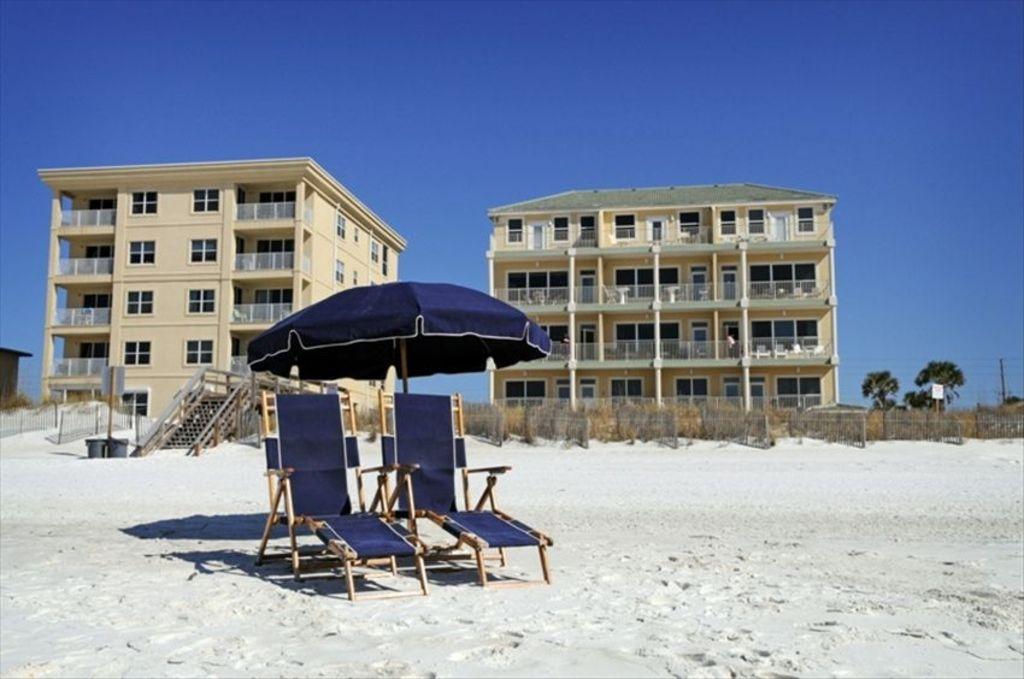 This beautiful two story penthouse unit is an ideal investment property with average gross rental income over the last two years of $54,000. This split bedroom plan has a large Master bedroom with it's own Gulf front balcony on the top floor and two additional bedrooms and two hallway bunk beds on the lower level. Unit comes rental ready with granite counter tops, ceramic tile and updated furnishings. Blue Dolphin bldg consists of just 10 units allowing for a very peaceful beach experience. Amenities include sundeck,heated pool, elevator and beach chair set ups. Building is being remodeled with new balconies, railings and exterior paint. Assessments for these improvements have been paid by the seller.