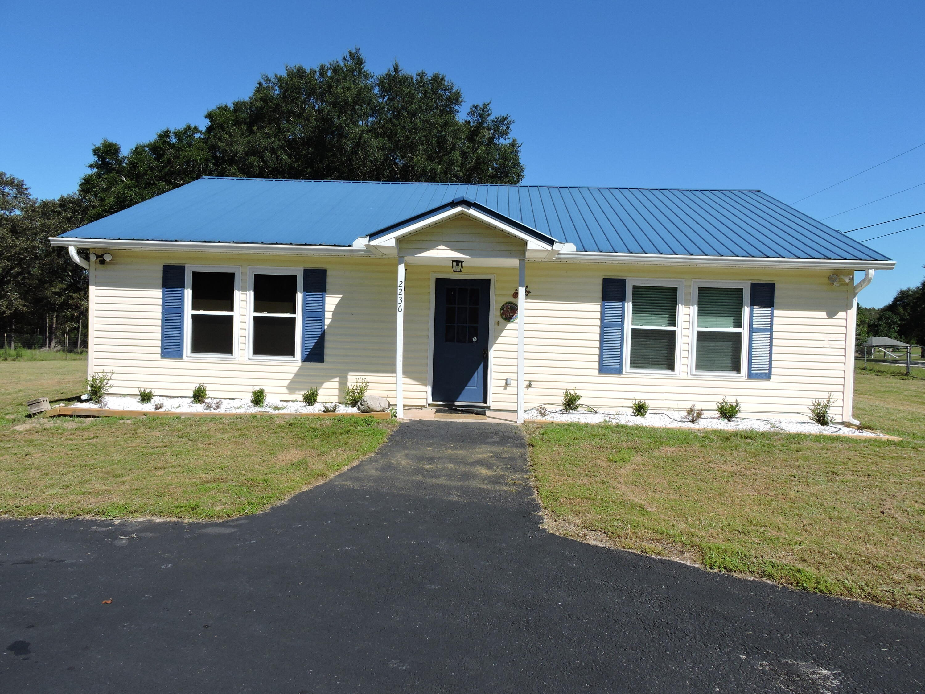 Available Now! Nice updated 2 bedroom 1 bath situated on an acre lot with lawn maintenance included.  The home offers an open concept kitchen/dining/family room with new cabinets/countertops/appliances.  The home has tile or laminate flooring throughout.  A washer/dryer is included! Schedule your showing today!