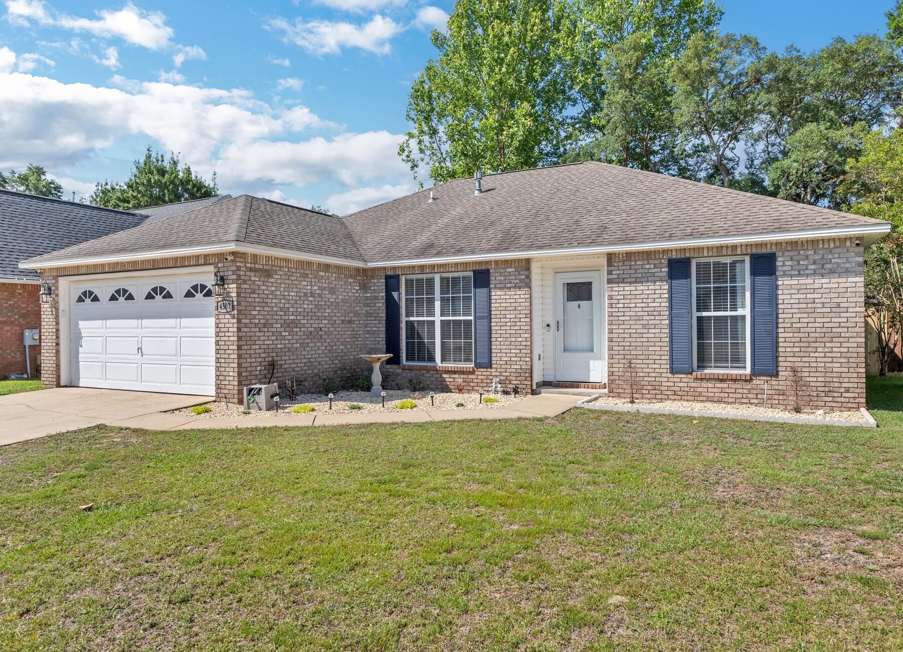 AVAILABLE BY...  June 19, 2023! 4bd/2bth. Home boasts natural light & is located in the highly sought after Bluewater Bay Subdivision!! This home is situated within walking distance to an elementary school, restaurants, coffee shop, grocery store, &  within 5 minutes of the most beautiful beaches! Kitchen has been newly remodeled & has granite counter tops with stylish cabinets accented with back splash, along with an oversized island. Living Room has a cathedral ceiling & features a fireplace. Enjoy the updated contemporary style bathrooms ready for any decor. Home has a new privacy fence & garage has a charging station for any electrical cars. NO smoking/NO cats due to medical allergy. Dogs allowed upon approval with a non-refundable pet fee. Lawn Care Included.