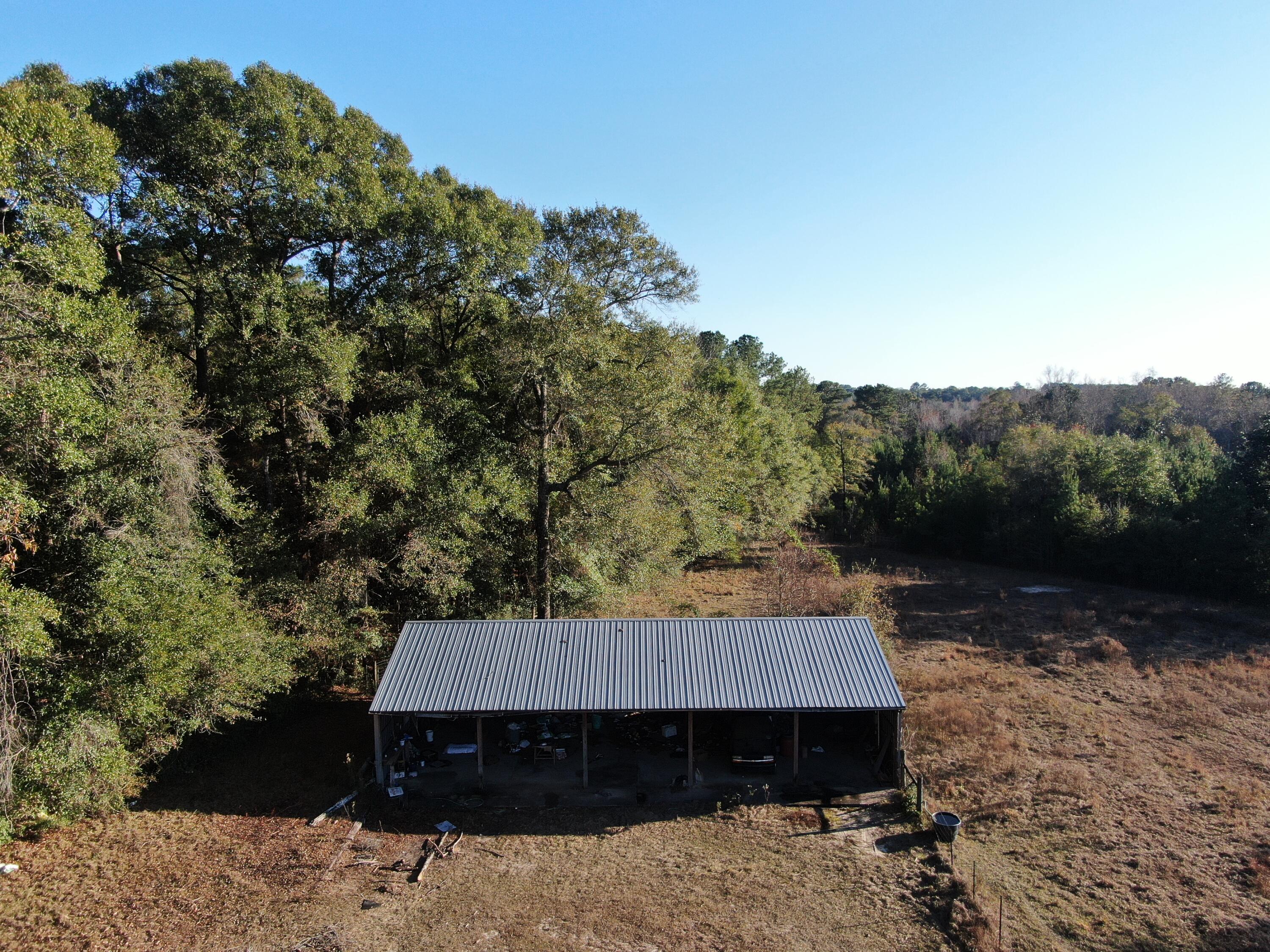 Welcome to your opportunity to own 68 sprawling acres in the peaceful countryside of Laurel Hill, FL—a rare piece of land that offers endless possibilities for your dream lifestyle. Whether you're looking to build your forever home, start a working farm, or simply enjoy the serenity of nature, this property delivers the perfect blend of beauty, space, and functionality.
Fully prepared for livestock, the land is completely perimeter-fenced, featuring a double-fence system designed to safely contain cattle or other animals. With wide-open pastureland, clear water creek, gently rolling terrain, and plenty of room to shape the property to your needs, it's an ideal setting for agricultural use. There is a large pole barn with power and water.  Welcome to your opportunity to own 68 sprawling acres in the peaceful countryside of Laurel Hill, FLa rare piece of land that offers endless possibilities for your dream lifestyle. Whether you're looking to build your forever home, start a working farm, or simply enjoy the serenity of nature, this property delivers the perfect blend of beauty, space, and functionality.
Fully prepared for livestock, the land is completely perimeter-fenced, featuring a double-fence system designed to safely contain cattle or other animals. With wide-open pastureland, clear water creek, gently rolling terrain, and plenty of room to shape the property to your needs, it's an ideal setting for agricultural use. There is a large pole barn with power and water. Outdoor enthusiasts will appreciate the area's abundant wildlife, making this a fantastic spot for hunting or exploring the natural surroundings. Whether you envision quiet mornings overlooking your land, cattle grazing across the fields, or weekend adventures in the woods, this acreage supports every dream of country living. If you're searching for privacy, space, and the freedom to create your own rural sanctuary, this 68-acre parcel in Laurel Hill is the perfect canvas. Build. Farm. Hunt. Live the lifestyle you've always wanted.