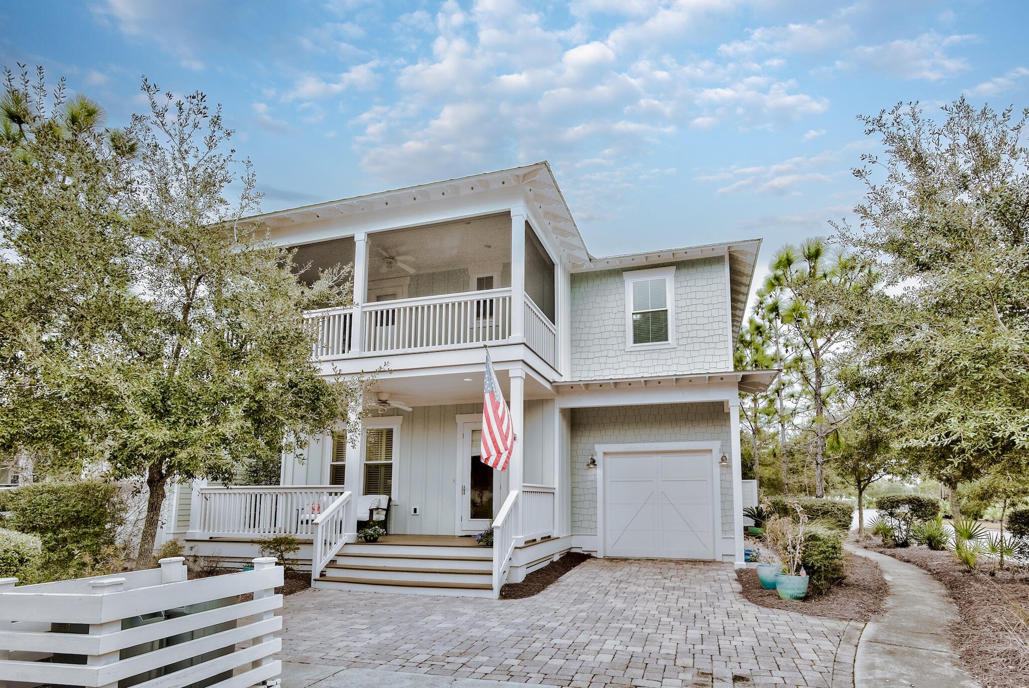This property is projected to bring in 135k in annual rentals, making it a lucrative investment for any second home or vacation rental buyer. The Windjammer plan is part of the Cottage collection and offers 3,037 square feet, one car garage, an owner's lock out closet, features dual master suites, 4BR/4.5B, open kitchen, dining, floorplan.  First floor includes office/flex space and shiplap walls. Kitchen features island with built-in wine rack and shelf ends, farmhouse sink, upgraded cabinets, granite, glass tile back splash, stainless steel built in appliances including gas cooktop, natural pine flooring throughout home, fire place, butler's pantry with sink, wine fridge, 2 laundry rooms, 1st floor master suite, 2 floor master suite, flex space with wine fridge on second floor. Amenities in community include a trail to the beach - just under 1 mile, The Gathering Place is centrally located and features a playground, heated lap pool, zero entry pool, hot tub, fire pit, grills, tv, bar area for parties and plenty of seating. Other community amenities include fitness stations, multi-purpose courts, pickleball, and trails throughout.