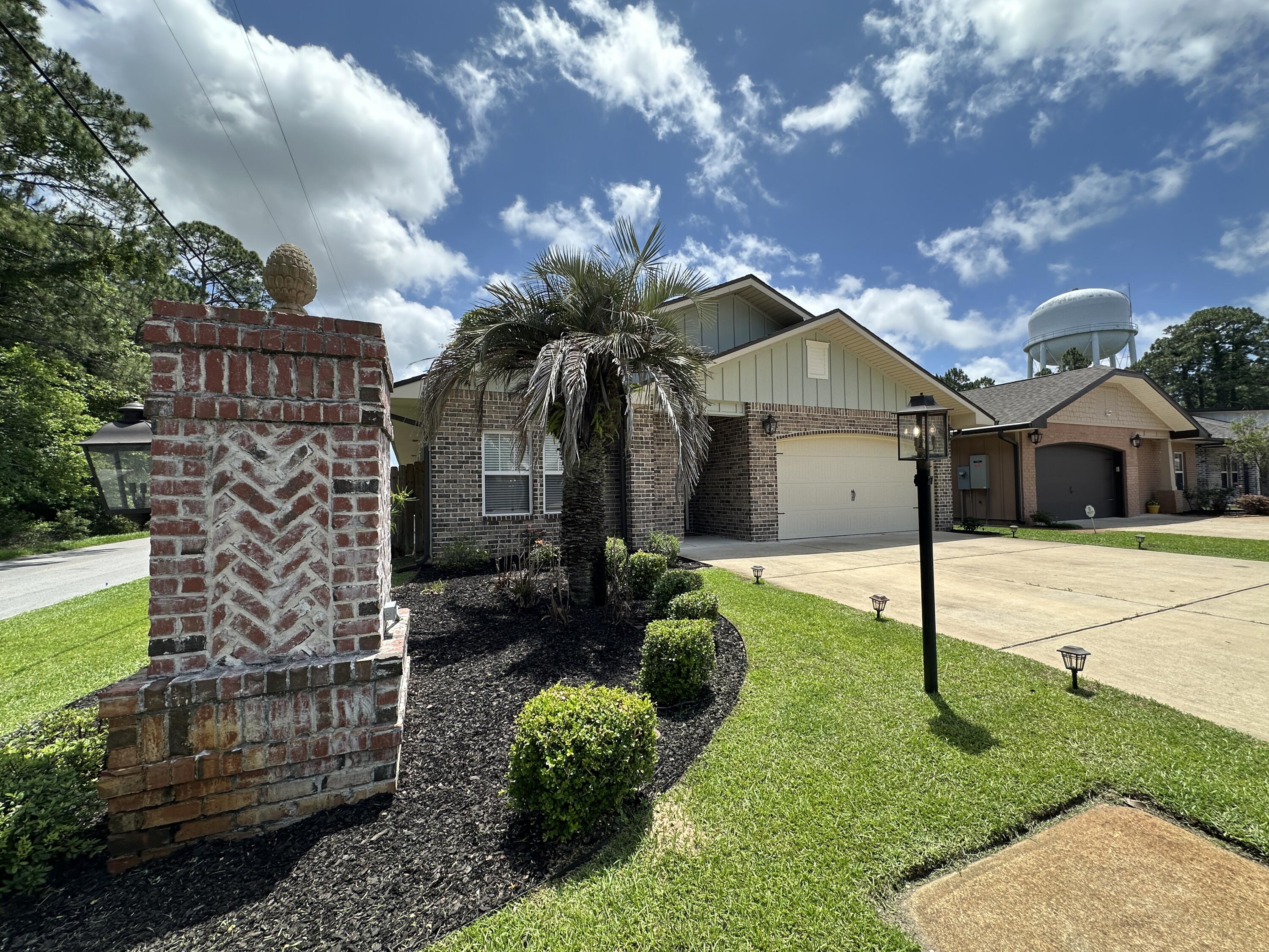 This beautiful craftsman style home in FWB will definitely wow and surprise you. Each of the 4 bedrooms is so spacious and the gorgeous and the open floor plan is a definite eye pleaser. The kitchen opens to the family and dining room and comes with granite countertops, stainless steel appliances, an amazingly long breakfast bar and it even has a commercial size, double refrigerator/freezer. There is no carpet here, for those with allergy issues or pets and the flooring is either a gorgeous  tile or LVP. In the master suite you will find beautiful crown molding, double walk-in closets, double vanities, separate shower and tub and a water closet for privacy. The back porch has been screened in so you can enjoy the outdoors, when you don't really want to be all the way ''outdoors''. There's a stone patio if you do want to enjoy the outdoors and the yard is privacy fenced and has a sprinkler system to keep the grass in great condition. This home is centrally located between the entrance to Eglin AFB and Hurlburt Fields back gate. It's close to dining, shopping, hospitals and more. It's just a great home!