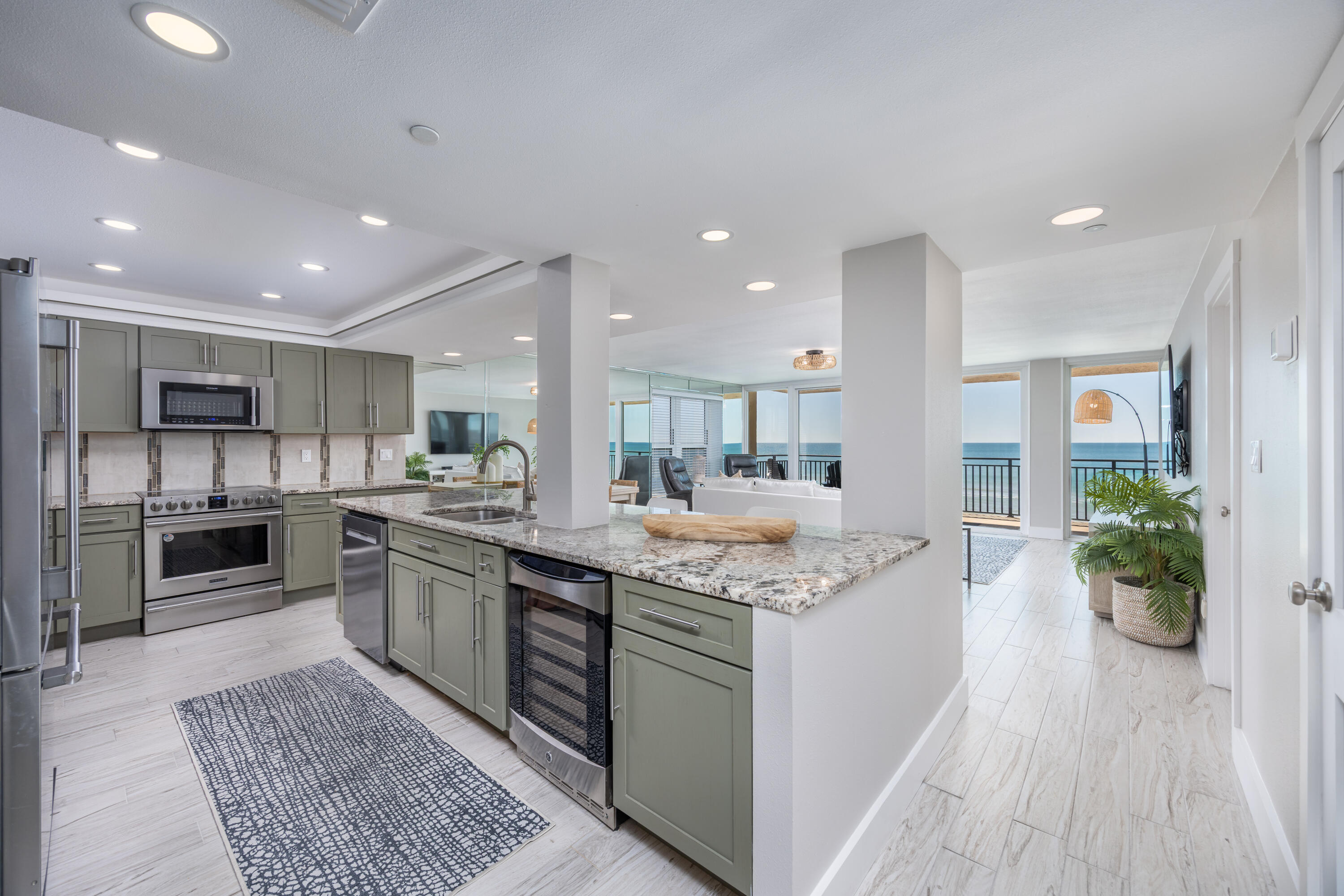 Discover luxury coastal living in this completely customized 3-bedroom, 3-bathroom end-unit condo on the exclusive 7th floor of The Breakers on Okaloosa Island. Offering 1,748 sq. ft. of thoughtfully designed space, this stunning residence provides direct, unobstructed Gulf views while being peacefully removed from pool noise. With secured elevator access and no short-term rentals on this floor, enjoy the privacy and tranquility of this premier top-floor corner unit. Unmatched Gulf front Views & Living Spaces Expansive living & dining areas designed to maximize natural light, featuring end-unit windows and floor-to-ceiling sliders leading to a private balcony with panoramic Gulf views.
Extended balcony (2nd largest in the complex) with a private exterior storage unit—(MORE) perfect for beach gear.
Media console pre-wired to extend into the master suite and bathroom.
Gourmet Kitchen - A Chef's Dream
Open-concept layout for a seamless flow and enhanced beach views.
High-end stainless steel appliances, soft-close cabinetry, a dedicated wine refrigerator & wine rack.
Granite countertops, under-cabinet mood lighting, and cove lighting above cabinetry.
Oversized 9-ft island & hall pantry for extra storage. Master Suite - A Luxurious Waterfront Retreat Direct Gulf-front views with private balcony access. His & hers closets for ample storage. Spa-like en-suite bath featuring a custom walk-in tile shower with a rain head, hand-held shower, and four body jets. Double vanity with backlit mirror, makeup mirror, under-cabinet lighting, and built-in speaker system. Two spacious guest bedrooms, each with its own full bathroom. Guest Bath 1: 71" soaker tub with a beautiful backlit tile accent wall. Guest Bath 2: Custom tiled shower with rock sink bowl and a shelf for bath essentials. Plantation shutters & mounted flat-screen TVs in both guest rooms. Additional High-End Features Full-size washer & dryer (rare for condos). Oversized water heater for continuous comfort. Plumbed for a central vacuum system for added convenience. This exceptional turnkey property offers the perfect blend of elegance, comfort, and modern convenience. With its high-end finishes, unmatched Gulf views, and exclusive 7th-floor location, this is truly a rare opportunity in today's market. Don't miss outschedule your private tour today!