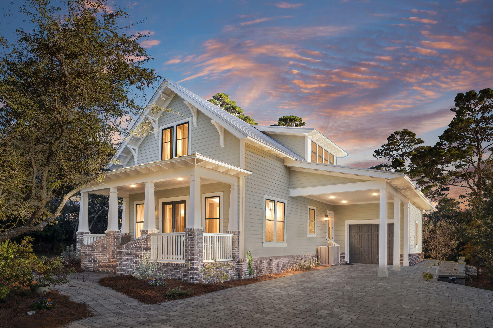 Tucked away on a quiet cul-de-sac, surrounded by magnolias and live oaks, this custom-built home, designed by architect Chris Stoyles of Archiscapes and built by Shires Construction, seamlessly blends timeless craftsmanship with modern comfort. 5 minute walk to Santa Rosa Golf Clubhouse & tee off, less than a mile to the beach, and minutes to Grand Boulevard, this thoughtfully designed home offers the ideal combination of serenity and convenience.

Inside, you'll find a spacious open living area with 10' ceilings, rich walnut wood floors, designer lighting, and wind-rated windows and doors throughout. The gourmet kitchen features quartz countertops, custom cabinetry with pull-outs, a deep double sink with filtered water, and a gas fireplace nearby that anchors the living area with warmth and charm.

The primary suite is a true retreat, offering French doors leading to a screened porch, dual walk-in closets with built-ins, and a luxurious spa-style bath featuring marble finishes, a freestanding soaking tub with jets, and a zero-entry glass shower. 

Upstairs, two guest suites each feature private baths, while a vaulted-ceiling den or office provides a quiet space with built-in shelving, storage, and remote-control shades.

Practical details elevate every space, from the under-stair storage drawers and organized laundry/mudroom to the epoxy-finished garage floor with built-in shelving and a tankless water heater.
Outdoor living is equally inviting with a screened-in porch, WeatherTech decking, a paver driveway, and a private wooded backyard framed by native landscaping. A well and irrigation system keep the lush greenery thriving year-round.

Enjoy the convenience of nearby shopping, dining, golf, and healthcare, all just a short drive from the white-sand beaches of 30A. Whether as a primary home or a coastal getaway, this home offers a rare balance of elegance, function, and location.

*Square footage per building plans is approximately 2,212sf. County records reflect 2,176sf.