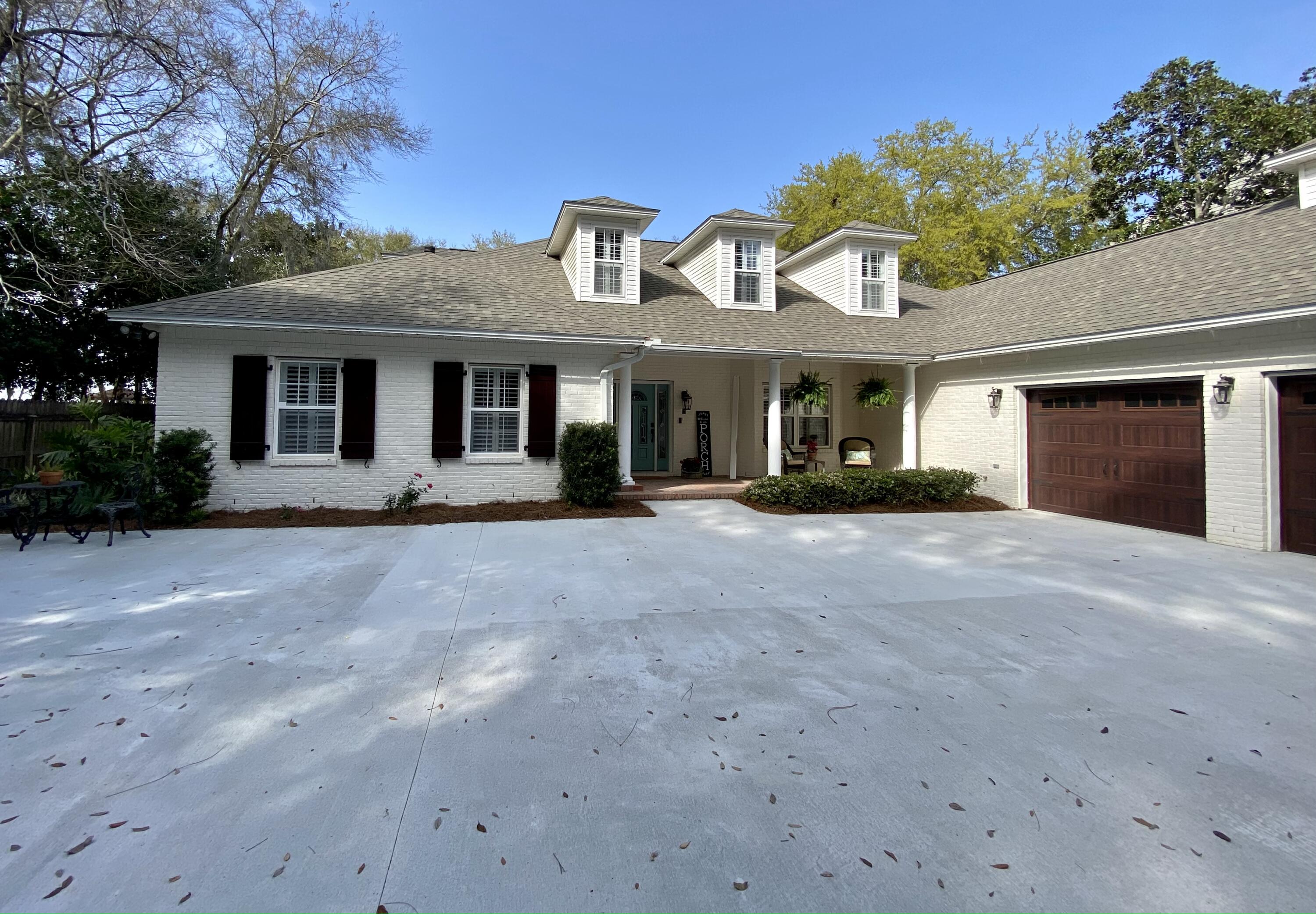 Professional pictures coming soon. This home has recently been remodeled. Private dock leading out to the bay with jet ski lift.   Private  screened in pool with an additional screened  porch off the kitchen area. Two Master Bedrooms on ground Floor with new bathrooms and closets. Bayfront estate size lot with new driveway and a gated front drive and an RV hookup. Coffee bar in the kitchen area and huge laundry room with another room for an office or workout room. Additional storage or workshop off the oversized garage heated and cooled. All dimensions to be verified by buyer.