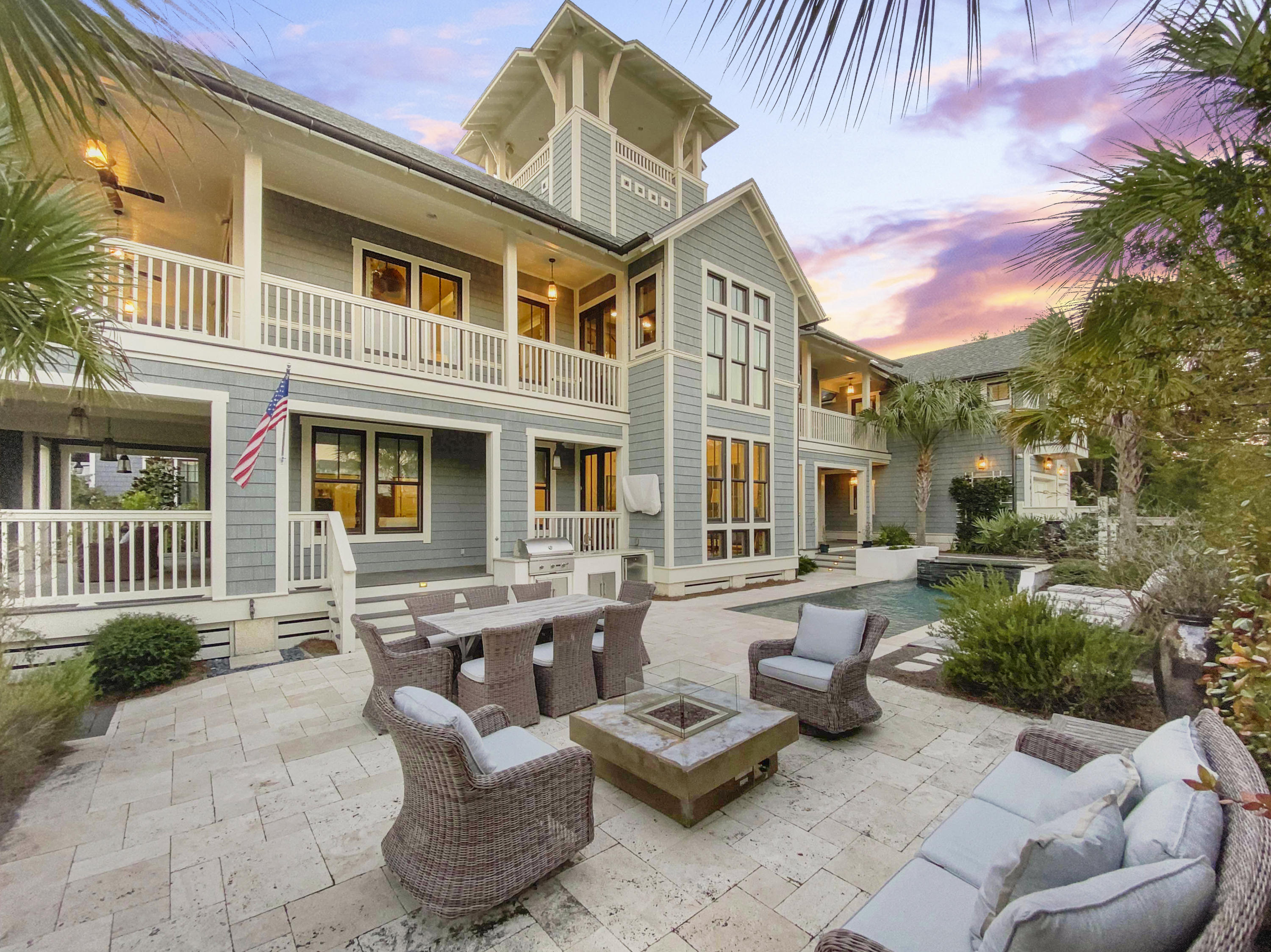 Stroll on the boardwalks to the pristine white sands and emerald waters in the Bridges section of WaterSound Beaches. Stunning views of Camp Creek Lake, this one of a kind custom home has been built to an impeccable quality rarely seen. The Tyler Doin design features a 3298sqft inverted floor plan to fully appreciate the Gulf views and Florida sunshine. Complemented by its comfortable carriage house, this residence is perfect for hosting just a few friends or large family gatherings.
Upon entering the home, you will be awed by the reclaimed black walnut hard flooring and the attention to detail in the tongue and groove walls and interior millwork. Enjoy the gourmet kitchen with top of the line Thermador stainless steel appliances and Quartzite countertops. The one of a kind custom backsplash is compiled of hand-painted Terracotta tiles.
The master retreat offers privacy and a beautiful en suite with custom tile.  Three more guest rooms with private bath and a carriage house complete the suite of bedrooms. Enjoy over 1500 sq. ft of porch space, perfect for an afternoon of reading or your morning coffee. Your personal backyard oasis includes a large heated pool, outdoor kitchen and sprawling patio area to fully embrace life at the beach. Gulf views from the second floor as well as the tower.
Additional amenities include: Home security system (hardwired, whole house audio system, gas fireplace, Rinnai tankless water heaters, newly painted exterior trim, air conditioned garage.
There is no other property quite like this, bringing a new meaning to luxurious coastal living. This incredible estate is a true gem of WaterSound Beach.
