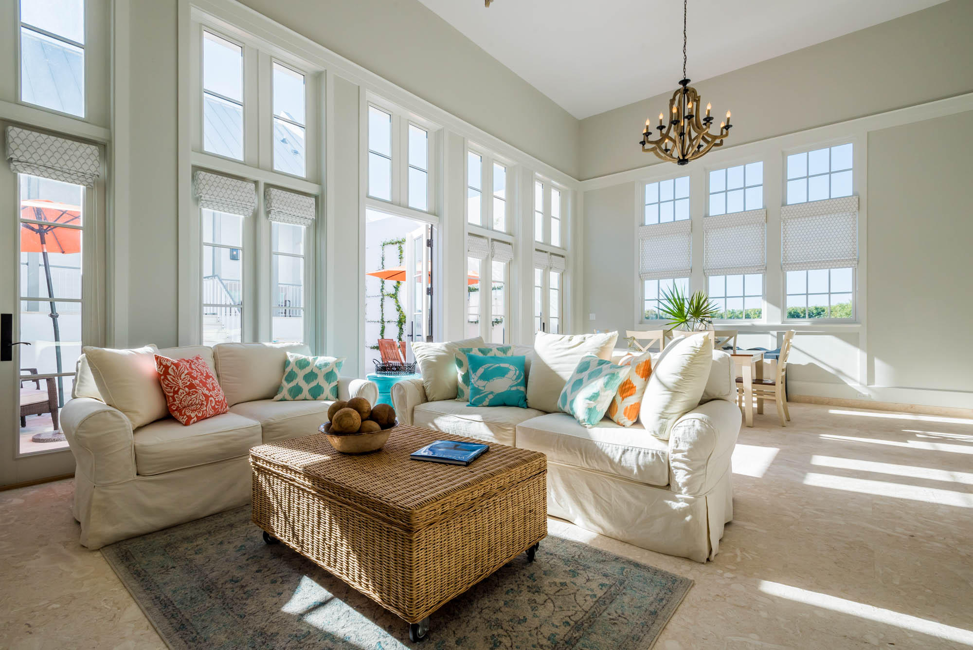 Upon entering this centrally located rowhome, fall under the spell of sophisticated coastal living in a light-filled private oasis. Caliza Courts rowhomes are designed by the renowned Khoury-Vogt Architecture team and form a welcome addition to the breathtaking Caliza Pool location. Beautiful architectural details have been woven into every space of this 4 Bedroom, 4.5 Bath home.
Impressive scale of the great room awes with 16-foot ceiling,12-foot tall French doors and windows opening to a private courtyard, and guest suite beyond. Floor plan offers the utmost in comfort to accommodate friends and families. The open concept kitchen captures views of southern sunbathed skies and offers top of the line Thermador appliances, cabinetry, and glass tile accented walls.
The main level Master Suite creates an expansive feel as it occupies the southwest corner above the iconic streetscape.  An elegant soaking tub, shower with Dominican Shellstone tile-surround floor to ceiling and twin vanities complete the Master Bath. Two Guest Suites, each with private baths are perched on the second floor, and enjoy a private Cuban tile accented west facing porch.  
Breezes enhance the private courtyard, accentuated by a serene fountain, dining area, fire pit, Dominican Shellstone paving, and easy to maintain espalier landscaping. Across the court, a covered, open-air loggia fronts a much-desired private guest suite (fourth bedroom), both raised above a two-car garage. Adding to the private experience, this suite has the midnight kitchen feature. The loggia offers another area for lounging, watching TV or dining.
Furnishings and electronics are included with a short list of exclusions.