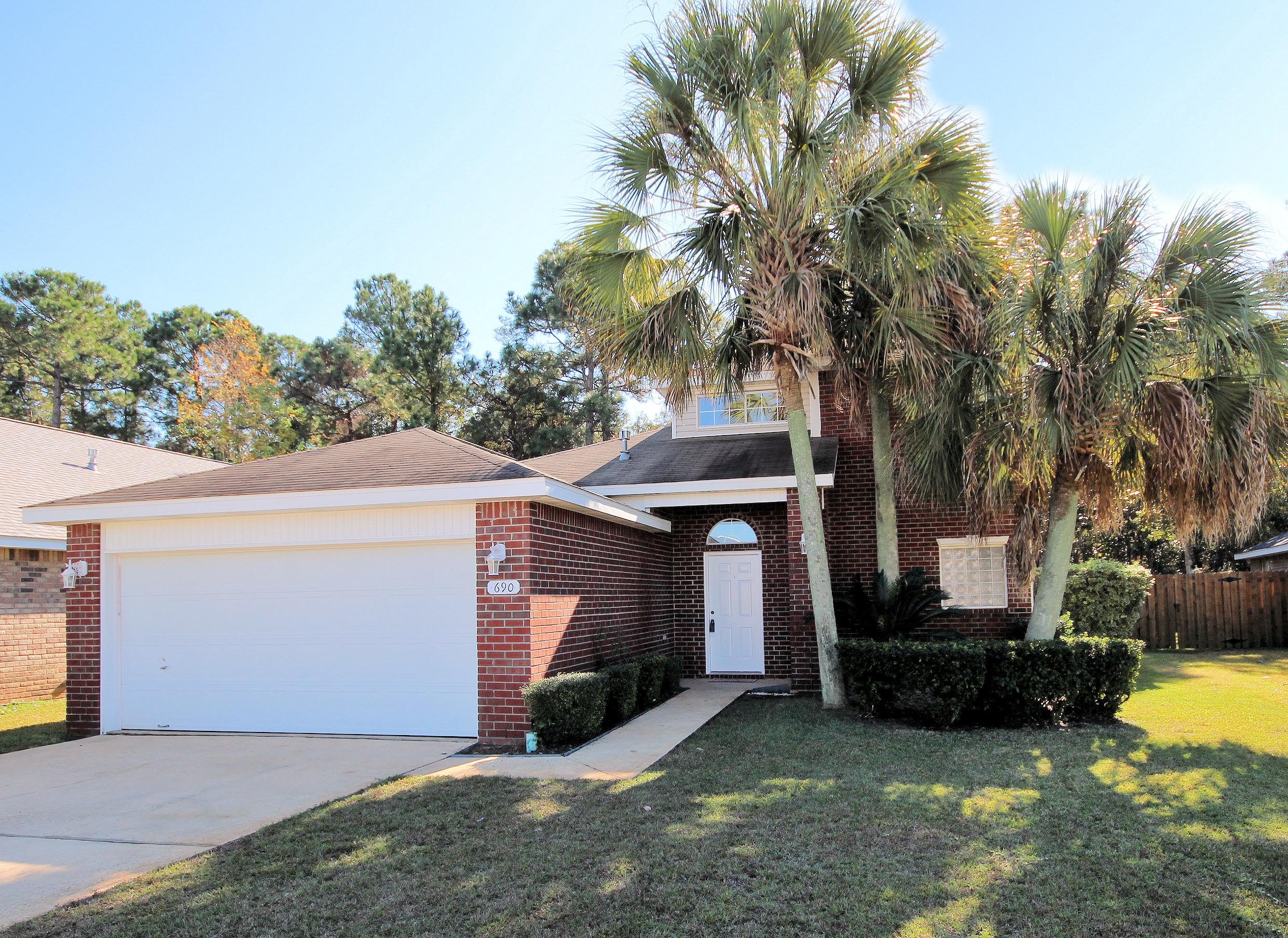''Location, location, location'' This charming house offers 4 bedrooms and 2 1/2 baths, wide open floor plan, three of bedrooms upstairs and the master down. The kitchen includes all matching stainless steel appliances and a large island with a breakfast nook and extra cabinets. Off the great room, through French doors, is a glassed in Florida room that easily serves as a sunroom playroom workout room or man cave. Covered grill deck for BBQ. Very close to both Hurlburt AFB, Eglin AFB, beaches,golf courses, mall, superstores and schools. Freshly painted inside. Also house comes with Hurricane shutters.
