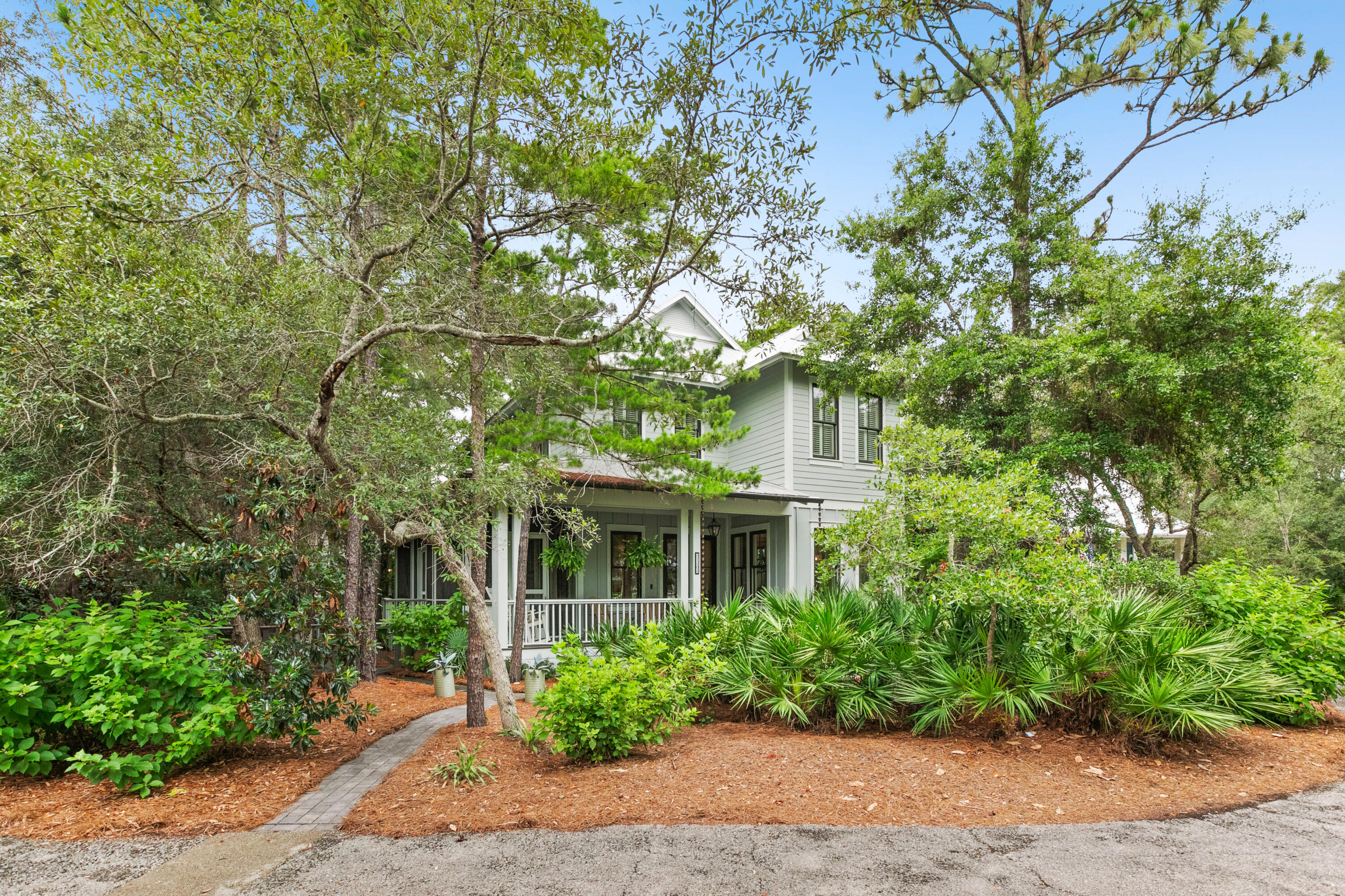 Never rented! This custom 3 bedrooms, 3.5 bath home with media/sitting room is located in the heart of Seagrove Beach. Situated on one of the largest corner lots, the exterior space is built to entertain. The exterior features an expansive wraparound porch screened the length of the home, outdoor gas fire pit, ample seating, grill, outdoor shower and parking for up to 5 vehicles. The interior offers approximately 2,253 square feet and features high end finishes, two master bedrooms, wood flooring throughout, tile in baths/laundry, quartz countertops, 10' ceilings and stainless steel appliances. The great room, kitchen, walk-in pantry, dining, half bath and master bedroom with private bath and access to the porch are situated on the first level. The second level features the master suite with private bath, additional bedroom with Jack-n-Jill bath to the media/sitting area, wet bar with wine refrigerator and laundry room. 
Nestled between Old Seagrove and WaterColor, the Hammocks is a unique community consisting of an intimate collection of residences, which blend harmoniously with each other, as well as with the rich natural environment and eco-system that is present. This unique environment creates a refuge for nature lovers, tourists and laid-back lifestyle seekers. The Hammocks is a tranquil, family-oriented, high-end, safe and peaceful boutique community for families that want to be near the beach, but out of the hustle and bustle that is typical in a destination beach community. Amenities include; two community pools as well as a private nature boardwalk that provides a launch point with access to Western Lake.  
Centrally located to the best dining, unique boutique shopping, bike paths and some of the most challenging golf courses the gulf coast has to offer. Easy access to Hwy 98, allowing you to explore the nearby cities of Destin or Panama City Beach, as well as, the Northwest Florida Beaches International Airport. Seller is licensed agent.