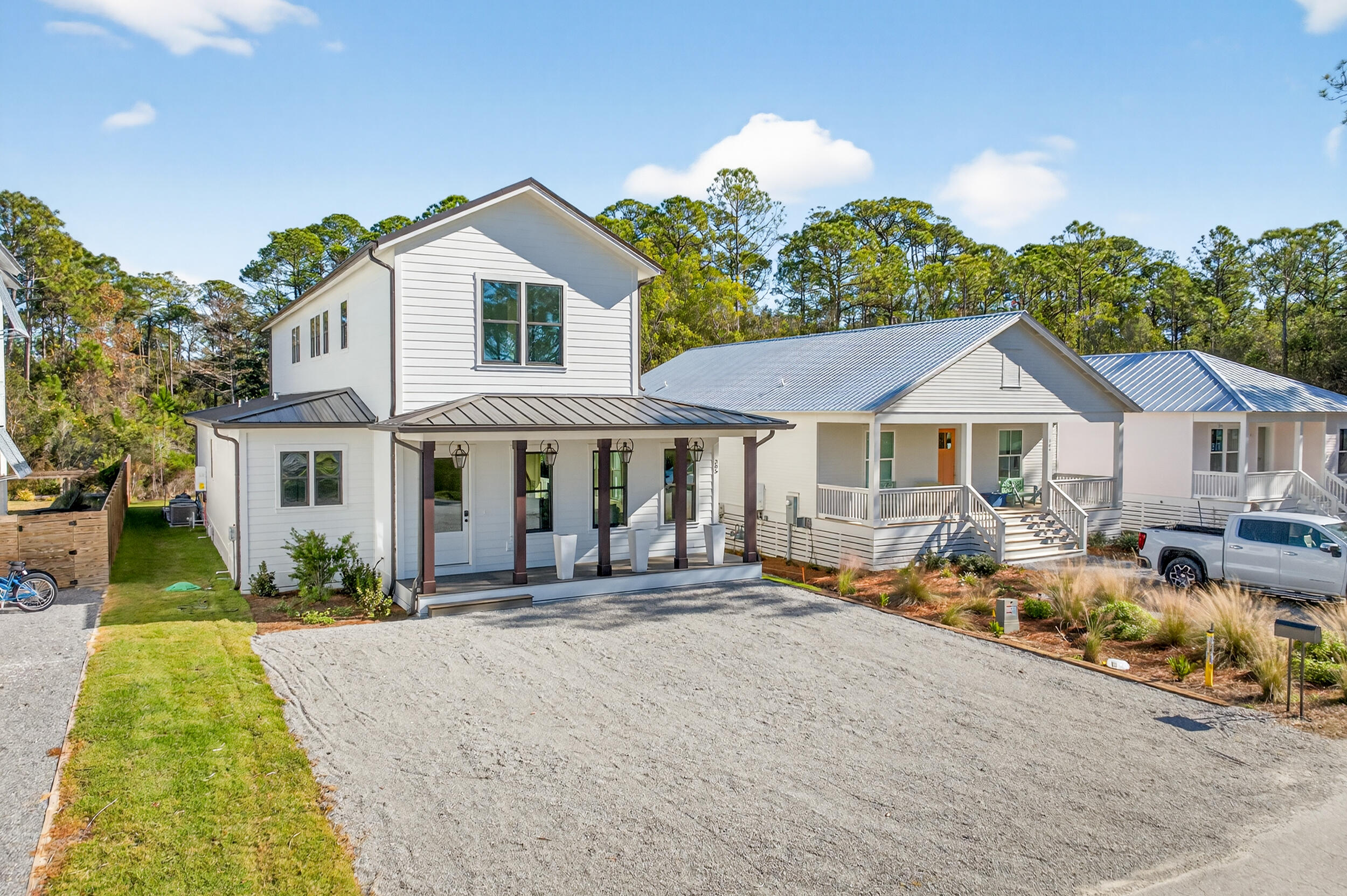 Discover the epitome of coastal luxury at 305 Elm St. in the desirable Gulf Shore Manor neighborhood of Seagrove Beach along Scenic 30A. This stunning 5-bedroom, 4.5-bath residence offers modern elegance and thoughtful design, perfect for family living or a premium vacation retreat.

Step inside to soaring 10-foot ceilings and oversized 8-foot doors that create an open, airy ambiance throughout. Premium features include foam insulation for energy efficiency, sound-insulated bathrooms for privacy, Level 5 drywall finishes for a flawless look, impact-resistant windows and doors for storm protection, and high-efficiency AC paired with natural gas amenities like charming gas lanterns, a gas grill, gas pool heater, and tankless hot water heater. The gourmet kitchen boasts a large hidden pantry and sleek under-cabinet lighting, while convenience abounds with laundry rooms on each floor, motion-activated automatic lighting on the stairs, and a recirculating hot water system. Outside, relax in your private heated pool overlooking a serene wooded rear lot for ultimate tranquility.

Located in the heart of Gulf Shore Manor, this home is steps from multiple deeded beach accesseseasily reachable on foot or by golf cartputting the sugar-white sands and emerald waters of the Gulf just moments away. Enjoy proximity to the iconic town of Seaside with its shops, dining, and events, plus a quick trip to Publix for everyday needs.

Surrounded by new construction homes, this property offers exceptional upside potential in a neighborhood that's rapidly elevating in value. Don't miss this rare opportunity to own a turnkey luxury home in one of 30A's most sought-after locations!