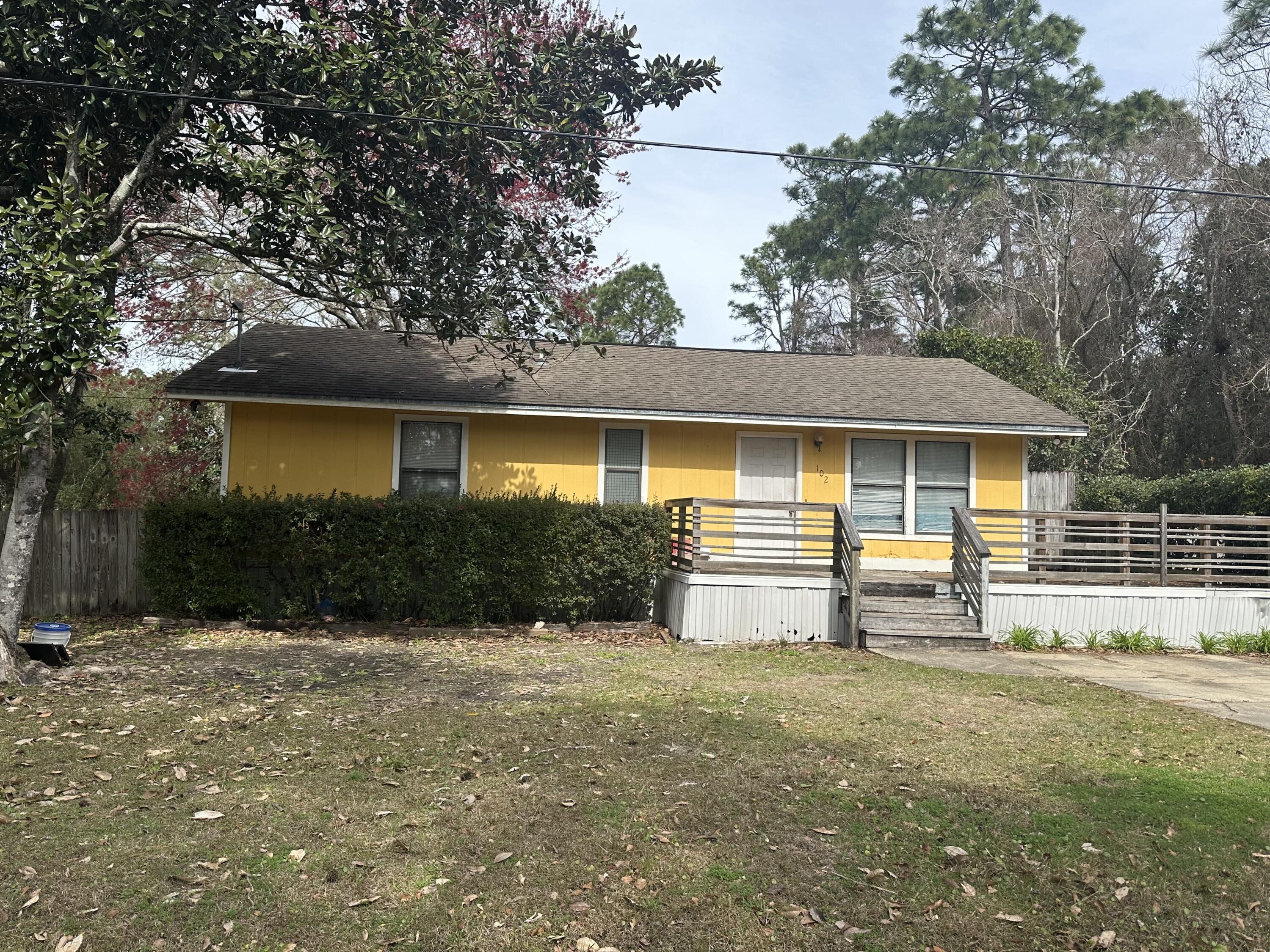 MOTIVATED SELLER! Don't miss this opportunity!  Here's a chance to own a cute fixer upper home with 4 lots. Room to expand, build new, or flip, plenty of options. This is your opportunity to own within a 10 minute drive to the sugar sand beaches on 30A,  Live in the existing home and build on the other lots and create rental income.  Short-term rentals are allowed.  No HOA!  As-is Sale.