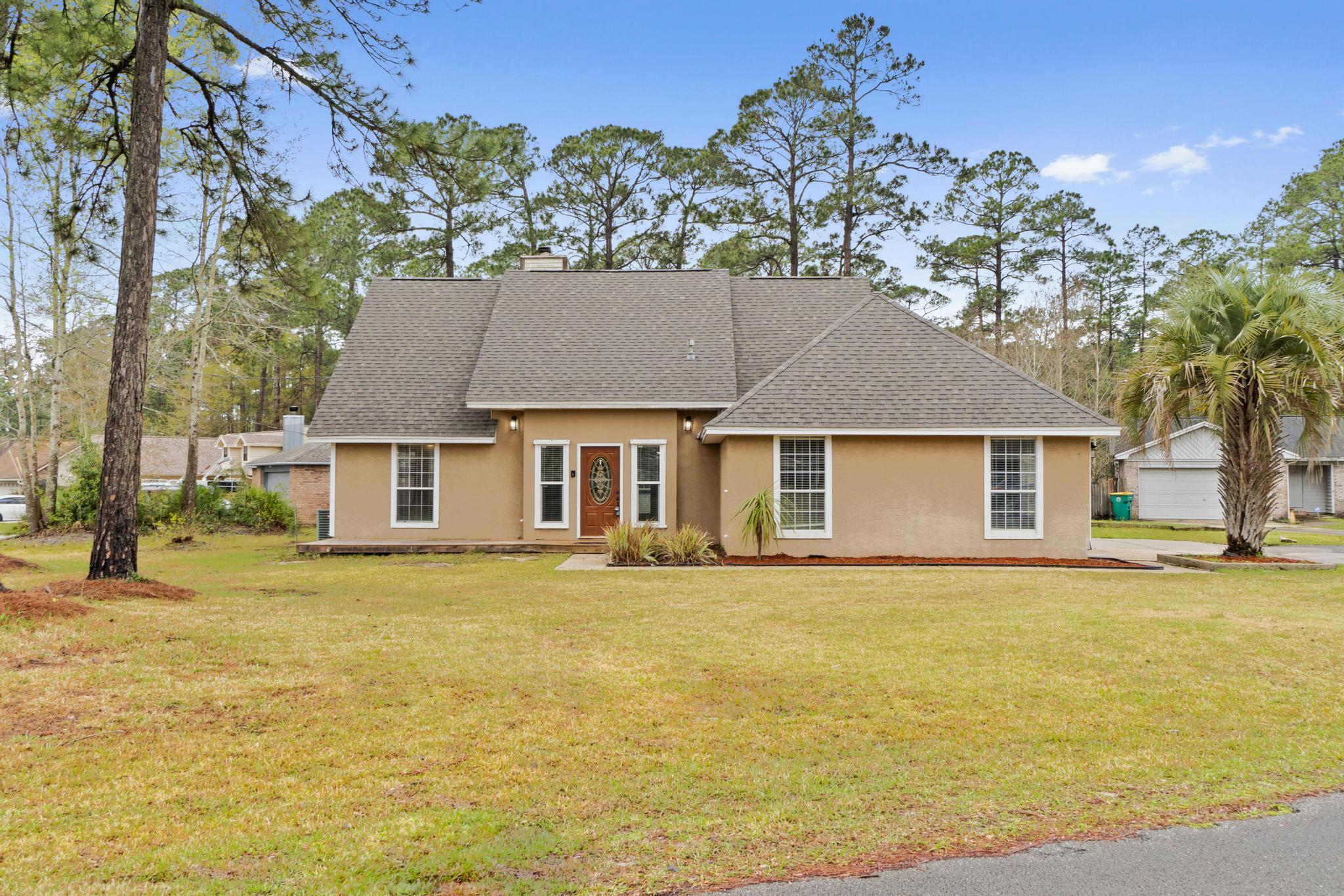 *Priced to sell, now with a new roof! The new owner will also have fully paid off solar panels for massive utility cost savings!!* Welcome to this spacious and beautifully updated home featuring 3 bedrooms, 2.5 baths, 2 large bonus spaces, room to finish an upstairs bonus room (or just have a TON of attic space for storage), and an above ground pool! Enjoy this perfect location with an easy commute to Hurlburt Field (10 minutes) and Eglin AFB (15 minutes). This oversized corner lot is located on a cul-de-sac close to the bus stop and bordering the Eglin reservation. Walk in the front door and you'll love the spacious entry way with recessed lighting and travertine floors leading to the soaring ceilings in the living room. The spacious space features  a fireplace and a split (more) floor plan with two bedrooms on the left side of the house connected with a jack and jill bathroom. The living room leads to the dining space which is open to the stunningly updated kitchen. This chef's delight features updated cabinetry, stainless appliances including a gas range, granite counters, and tile backsplash. You'll love the updated details like crown molding and hard surface flooring throughout, and off the kitchen you'll find an adorably charming half bathroom. The large master bedroom showcases an en suite where you'll love relaxing! Double vanities are accented by an additional makeup space with a tiled shower and a massive walk in closet complete with built ins. The garage was converted into a massive bonus room (there is a closet but is shared with the water heater) perfect for an office, home gym, playroom, etc. Also, uniquely when the home was built it was framed to have an upstairs bonus room over the garage. It's a massive space that could be finished off or just used as a TON of attic storage! The other additional space is the gorgeous Florida room with a custom wood ceiling, it has it's own outside condensing unit to heat and cool the space. This fantastic space leads to the outside where you'll find pavers following the walkway to the outside storage building, a raised platform, and above ground pool. With paid off solar panels you'll enjoy massive savings on utilities! Don't miss out on this lovely home in a perfect location! (Solar panels to be reinstalled. New photos were taken before reinstallation.)