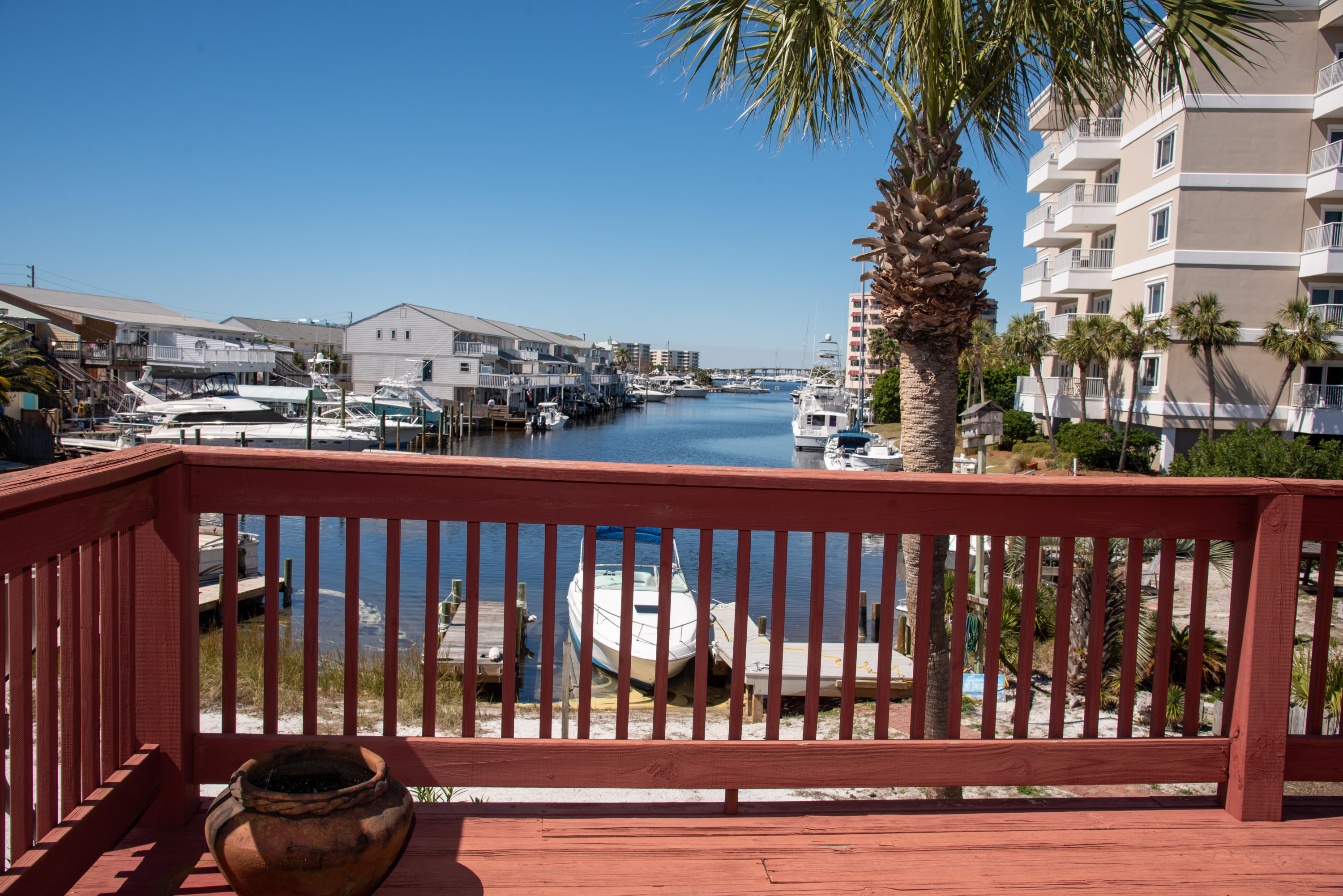Enjoy overlooking the Destin Harbor with fabulous views from the upstairs balcony off the master bedroom. Two bedrooms share the full bathroom upstairs. Entertain on the back covered patio, rain or shine. Slide your kayak or paddle board into the water for a short trip to all the waterfront activities of Destin Harbor and the famous Crab Island! All stainless steel appliances and new granite countertops in the kitchen with a breakfast bar. Dining living room combo open up to the patio and half bath downstairs off the kitchen. NO PETS. NO SMOKING. Tenants pay utilities and must comply with Holiday Isle Improvement Association rules. Harbor access is shared at this time. Long term rental only and no subletting allowed. Make appointment to see!