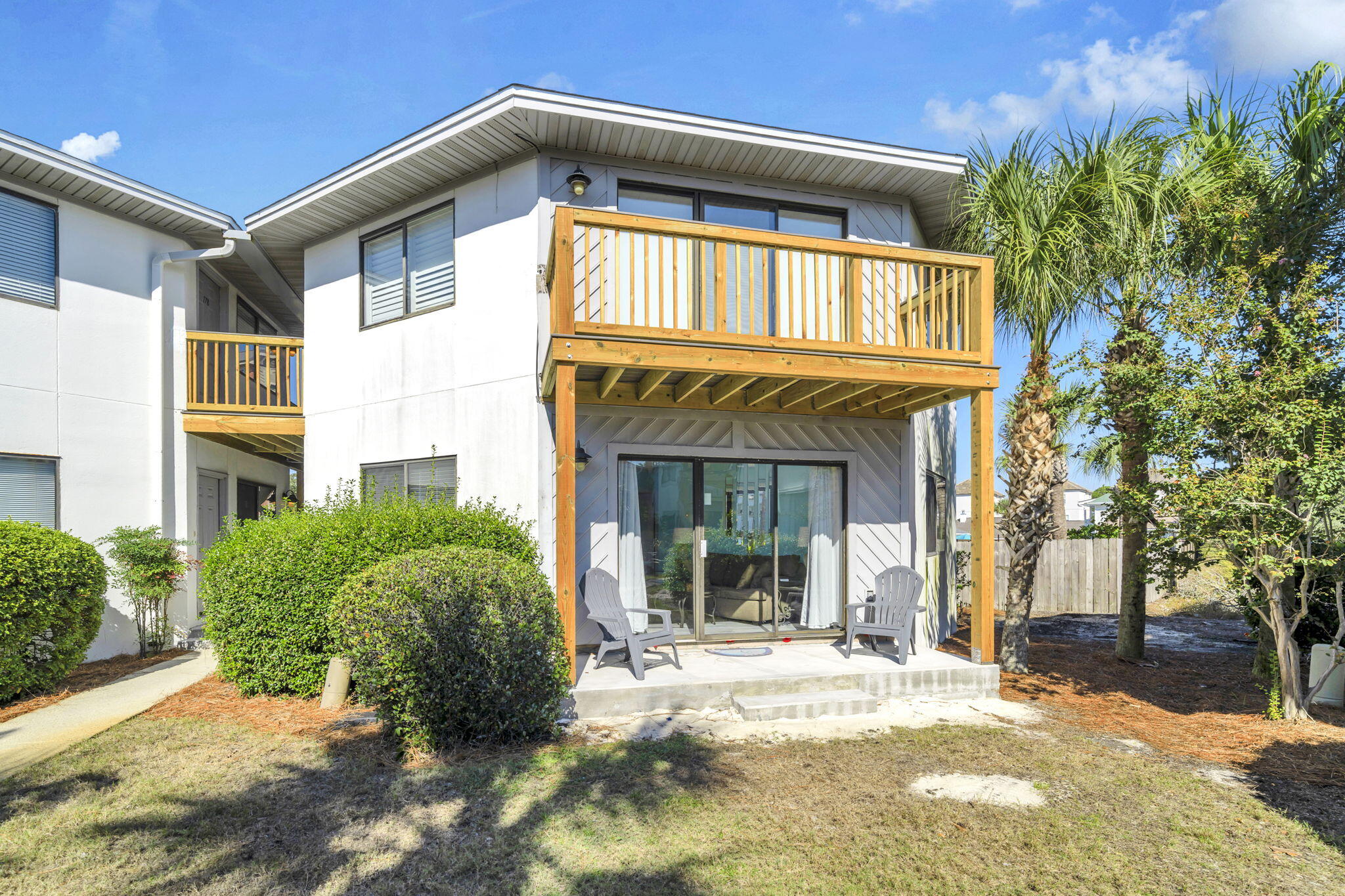Only 21/2 blocks from the beach! Two pools and designated parking. Ground-floor with no stairs to navigate. Breezeway and porch renovations have been completed by the Association and this unit is ready to sell. The newly completed back deck is surrounded by vegetation and is very close to the pool entrance. Brand new dishwasher installed in Aug 2025.
