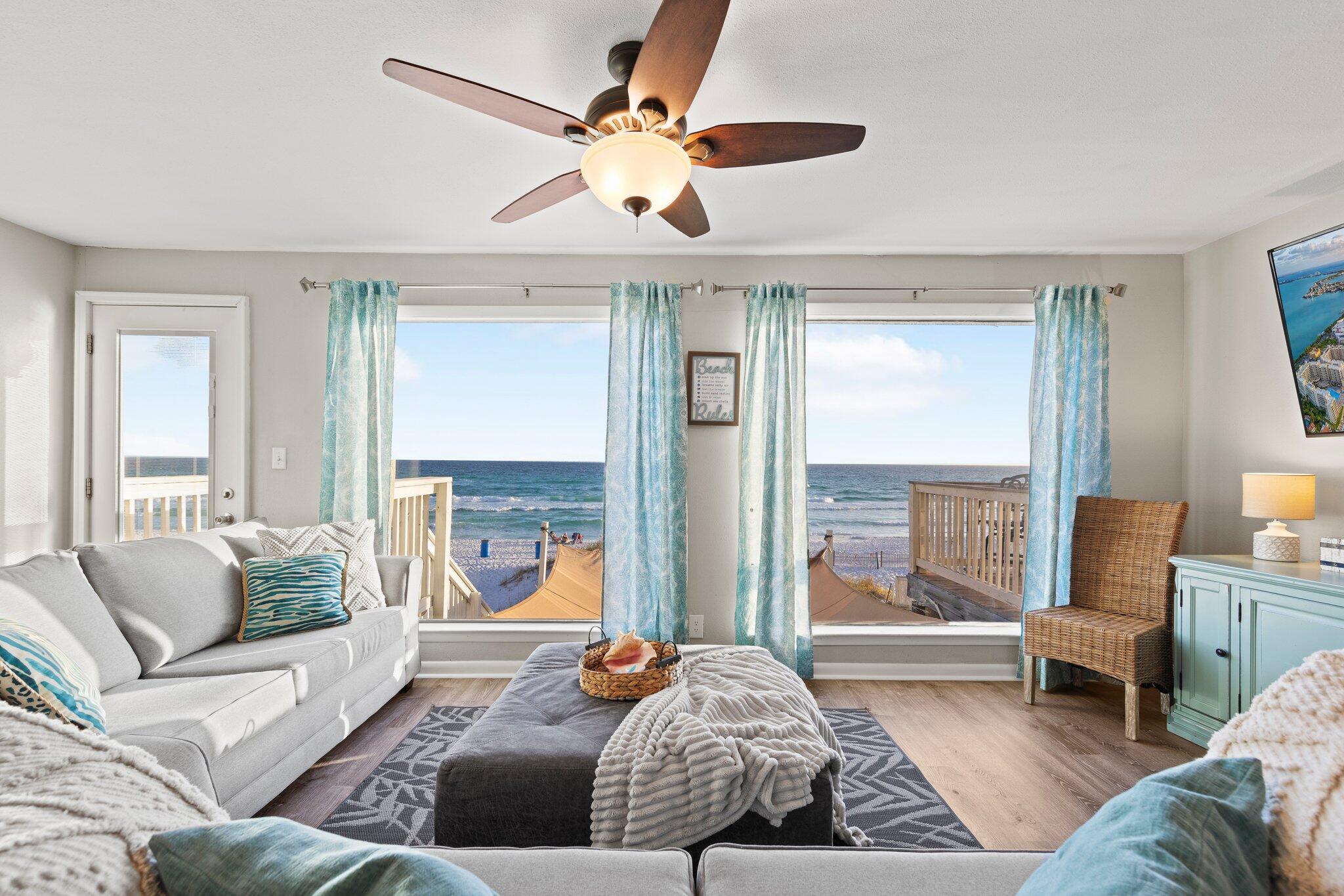 Rental projections at 200k!! Welcome in to this newly remodeled gulf front townhome in one of Destin's most coveted communities. Retreat to the beach in luxury or rent this fabulous beach property boasting over 200k in rental projections. While some properties have beach access, at this home you actually own to the high tide line and is exclusive to you and your guests. To prevent the public from using your 36' of beach the HOA has a seasonal security guard patrolling this portion of the beautiful Emerald waters.
As you walk in you'll be drawn to the gorgeous gulf views from several large windows along the main floor. This floor provides the primary kitchen with a breakfast bar along with the dining room, living room, half bath and bunk room. room. Wake up in the morning to gulf views in the master suite that opens to a private 20x10 balcony to enjoy the sounds of the waves with your coffee. The master bath boasts a soaker tub and luxury finishes throughout. Another bedroom and two full baths are also on the 3rd floor.  A second bunk room and kitchen, family room, full bath and bedroom are on the bottom floor that opens to the large deck and easy access to the beach. In 2019 both kitchens and all bathrooms were updated. Recent updates include new floors and paint throughout most of the home, new hot water heater and hvac, light fixtures, some furniture and decor, refrigerator, and grill.  Turnkey ready as a beautiful primary home or vacation machine that sleeps 16.