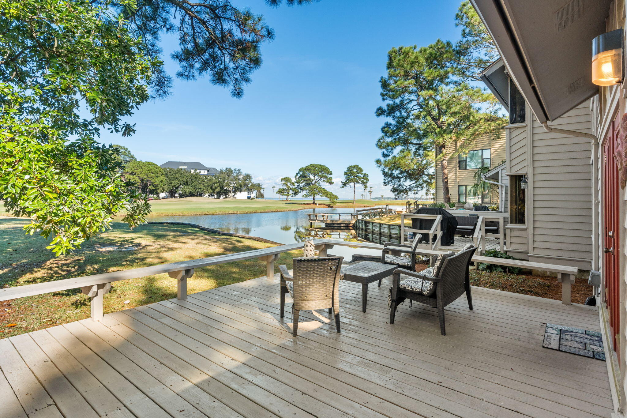 FULLY FURNISHED. GOLF CART INCLUDED. GOLF COURSE AND WATER VIEWS. Elevated coastal  and resort living awaits. This light-filled home offers an open living area, two main-level bedrooms including the primary suite, and an upstairs guest suite complemented by a serene loft lounge. Step onto the expansive deck to take in refined outdoor living and captivating golf course and bay views. With impressive rental performance and turnkey convenience, this residence is ideal for both investment and indulgence. What truly makes this home special is its location inside Sandestin Golf & Beach Resort. You're wrapped in 2,400 acres of 4-championship golf courses, a full serve marina, tennis center, miles of walking and biking trails, dining, shopping, and the freedom of golf-cart living.