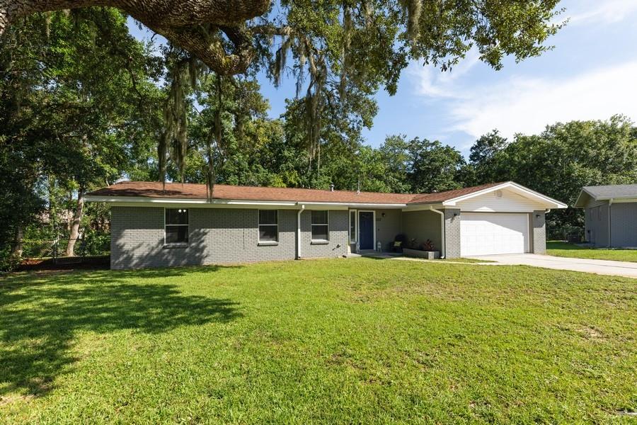Welcome home! This charming 3 bedroom, 2 bathroom mostly brick home is located on an over-sized cul-de-sac lot in the highly sought after Northgate Estates subdivision central to both Eglin and Hurlburt AFB.  The home itself is gorgeous and newly renovated to include a light & bright kitchen with a large island and breakfast bar seating that flows directly to the large dining room featuring  a double-sided brick fireplace. A den lies opposite the dining room, lined with a multitude of windows showcasing beautiful views of the wooded creek right in your very own backyard . There is a screened in Florida room great for morning coffee or after dinner relaxation. A second living area at the front of the home is a perfect playroom for kids or a formal living area. The master bedroom features 2 closets and an en-suite with a newly tiled walk-in shower. The guest bathroom is also newly renovated. Additional bedrooms are great sized with large closets. Schedule your showing today, this one won't last long!