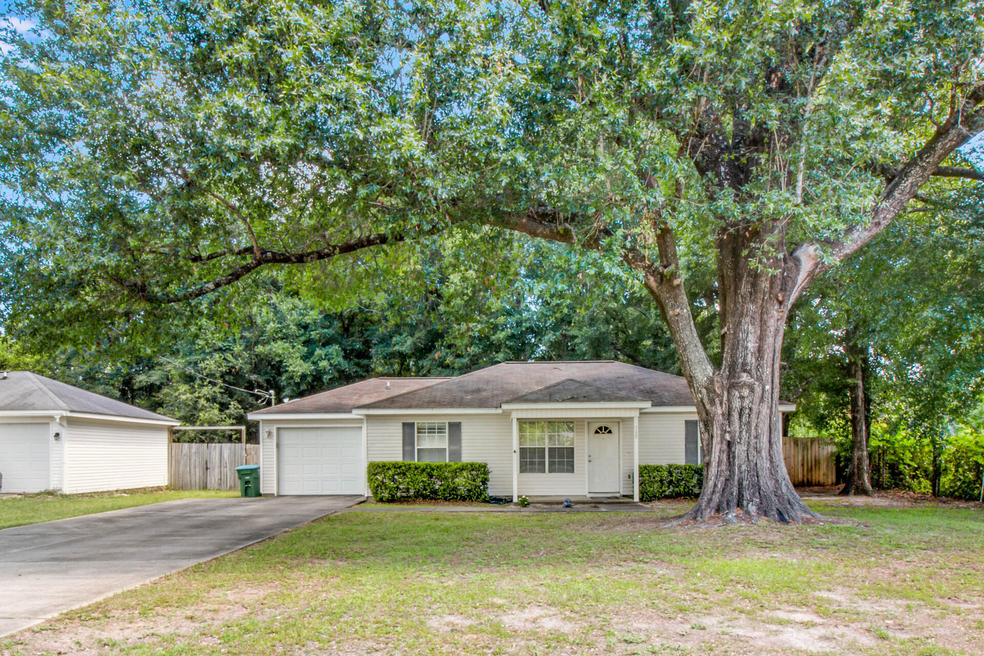Check out this awesome three-bedroom two-bathroom home with a garage and large fenced in back yard. This turn-key home features updated flooring throughout the common areas and bedrooms. The primary bedroom is located on one side of the home with a connecting bathroom and a walk-in closet. Across the home are the second and third bedrooms, with the second bathroom conveniently located in the hallway between the two bedrooms. The kitchen features plenty of cabinet space, counter space and an upgraded stainless fridge. The laundry room is thoughtfully connected to the garage, making it an ideal mudroom for those hot and messy Florida days. The large back yard features a privacy fence and tons of space for any outdoor activities or shops/sheds. The seller will install a NEW ROOF prior to closing. There are no issues or problems with the current roof. The insurance companies are requiring homes with a 15+ year-old roof to be replaced regardless of the life expectancy of the roof. 
Check out the 3D tour!
Schedule your showing today!