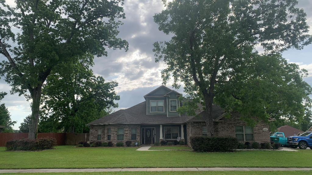 Custom home on a large corner lot in Carnegie Hills. This gorgeous home has mature pecan trees and fully irrigated lawn. The home boasts over 4080 sqf living with 4 bedrooms, 3 full baths, and two half baths plus an oversized 2 car garage. The home has full spray foam insulation keeping this large house very energy efficient. Once in the home you will find a custom gourmet kitchen that gives you all the storage space and counter space for you could need The maple cabinets with raised panels are custom designed for form and function. You will also find a large walk-in pantry, kitchen island with sink, and a breakfast bar. The living room features a coffered ceiling with large crown molding. The spacious den has 10' tray ceiling and in wall surround sound. There is also a separate office with solid wood French door. The large Master suite features a large bedroom leading into a beautiful bathroom tiled shower and a corner jetted tub. When you step out the back doors you will be greeted with a beautiful in-ground pool a back porch that runs the full width of the home. The upstairs features a large game room/family room, office area, as well as a separate movie theater.