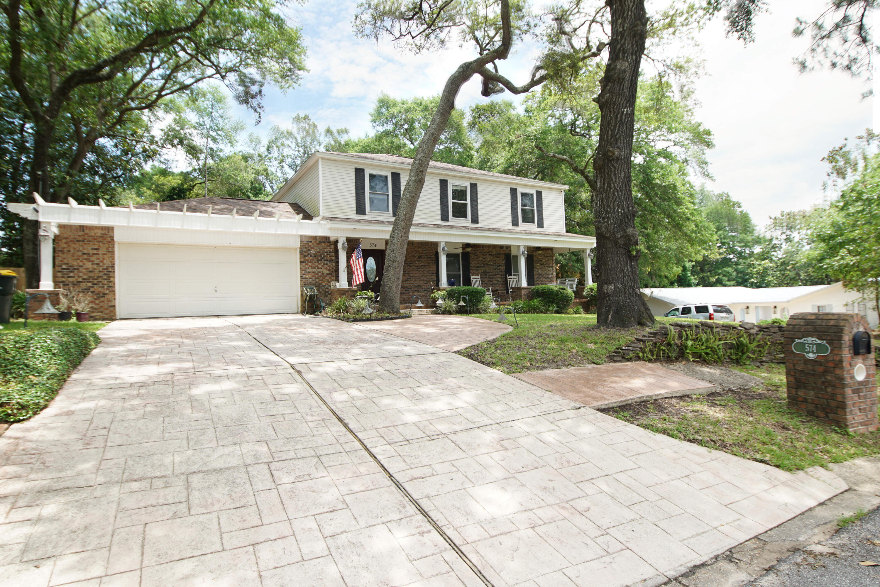 Available July 1st! Beautiful 4 bedroom and 2.5 bath home with 2225 sq ft located in a cul-de-sac in the desirable Kenwood Subdivision and only minutes to the air force bases, beaches, shopping, and restaurants! This executive home has updated kitchen and bathrooms, two living rooms, two dining spaces, fenced backyard, and a two car garage. There is additional parking available in the driveway. The large primary bedroom is located on the 2nd floor and features an ensuite bathroom with a walk in shower and a double vanity. In addition a full guest bathroom with a tub/shower combination and three additional bedrooms are on the 2nd floor. Downstairs there is an updated kitchen that opens to an eat in dining area/bonus room, the separate dining room, and a living room with a fireplace! In addition, there is a separate, large extra living room space and a half bath. Relax and enjoy the quiet tree lined street from the large covered front porch or grill out on the open patio in the backyard. Utilities, internet, pest control and yard maintenance are the tenant's responsibility. Pets must be approved by owner and there is a nonrefundable pet convenience fee.  NO smoking, good rental, employment and credit history, nonrefundable cleaning fee/carpet cleaning fee. There is be an application fee.