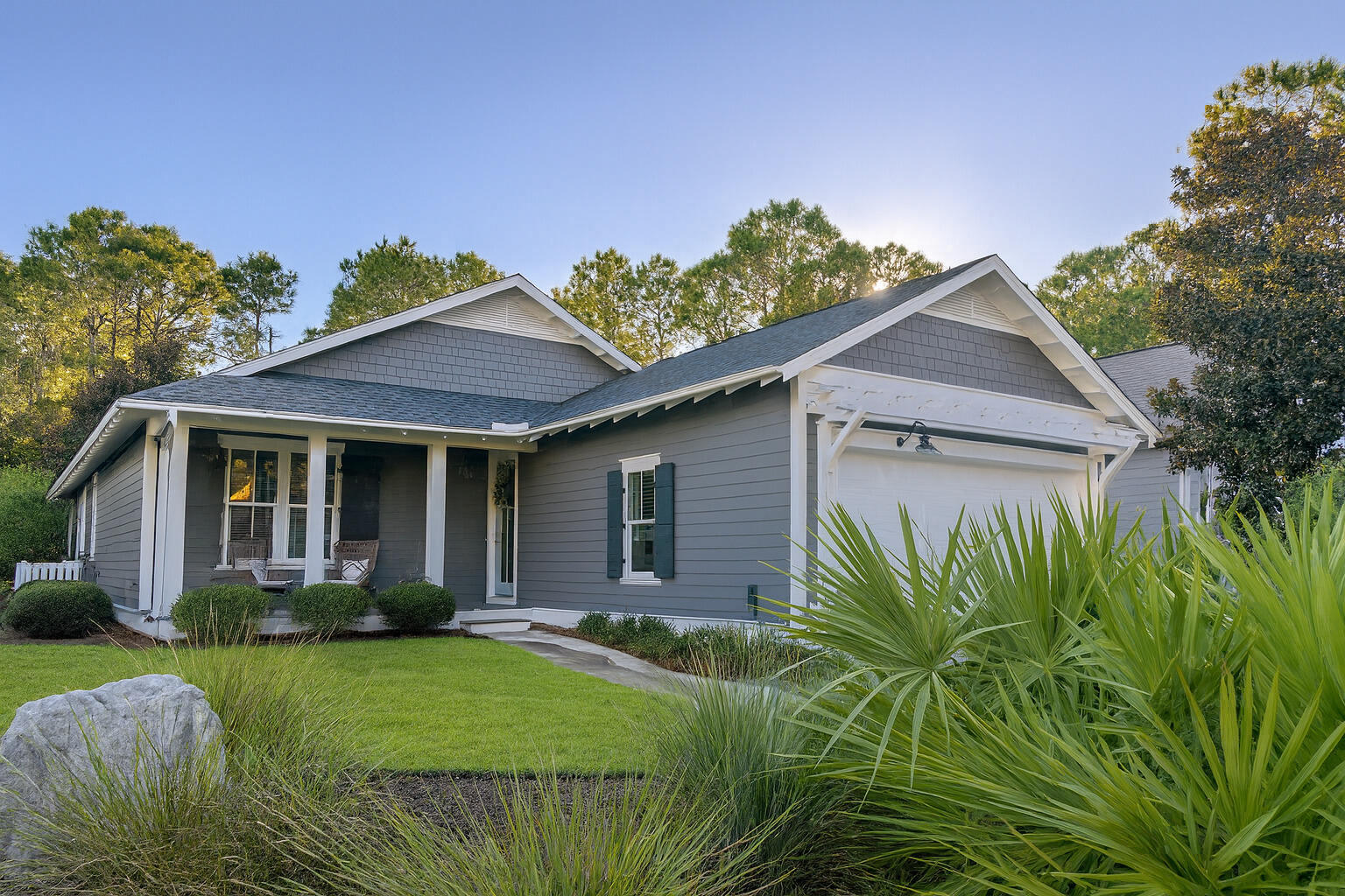 Experience coastal elegance in this luxurious Florida cottage home with open living spaces and hardwood floors. Enjoy bright living areas with nature views, a kitchen boasting luxury countertops with stainless steel appliances, vent hood, gas range and pantry. The two-car garage and built-in locker nooks provide convenience and storage. Nestled in a wooded area with mature landscaping, this home offers privacy due to lot location - no back yard neighbors. Built by the esteemed Huff Homes Builders, this floor plan showcases quality craftsmanship and thoughtful design, offering a harmonious balance of refined finishes.