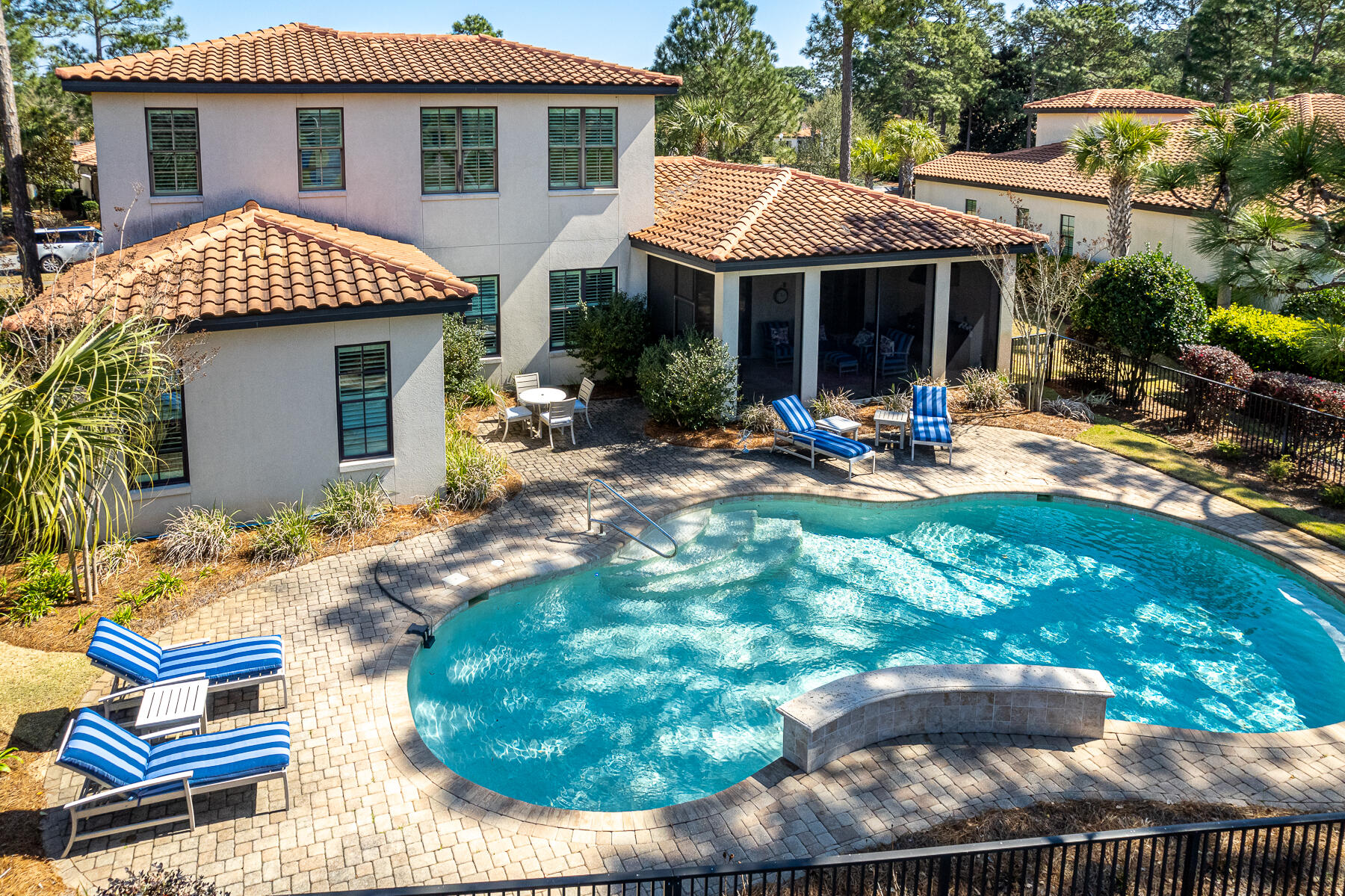 Built in 2015 by renowned Huff Builders, this Mediterranean estate boasts timeless elegance. Unwind on the screened porch with a summer kitchen or cool off in the pool. Located on #4 tee box of Baytowne Golf Course and offers views of #3 tee to green and #2 fairway and green. The chef's kitchen showcases a gas range, white cabinetry, subway tile backsplash, and a dry bar with a beverage cooler. The main level is graced by hardwood flooring and hosts the primary suite, guest suite, and powder room. The primary ensuite is a luxurious retreat, complete with a roll-in shower, double sinks, and an oversized walk-in closet featuring temperature-controlled wine storage. the second level offers a spacious living area and two additional bedrooms, each with a private bathroom. The home features a handicap-accessible ramp in the garage as well as a Tesla charger. Genoa owners enjoy access to the two new heated SOA pools: One across from Linkside Village on Audubon Drive and the Phil Hummel Aquatic Center centrally located at the Baytowne Ave Traffic Circle.

As an introduction to the Sandestin lifestyle, we invite our new owners to explore amenities that make Sandestin special. The listing brokerage and seller(s) are presenting the buyer(s) of this property with (2) 90-minute rounds of Tennis court time, a golf foursome at one of our three championship courses, and a round of golf for up to four (4) players at the unrivaled Burnt Pine Golf Club.

Sandestin Golf and Beach Resort features more than seven miles of beaches and pristine bay front, four championship golf courses, 15 world-class tennis courts, a 226-slip marina, a fitness center, spa and celebrity chef dining. Shop, dine and play at the charming pedestrian village, The Village of Baytowne Wharf and more. Inside the gates of the resort, residents enjoy a balanced lifestyle of high-class living, spanning the 2,400 acres from the beach to the bay. Everything within the gates of the resort is accessible by golf cart or bicycle. The entire resort is interconnected by miles of pedestrian, bike and golf cart paths that weave through groves of live oaks, meandering past natural lagoons, fountains, man-made lakes, and meticulously landscaped fairways.
