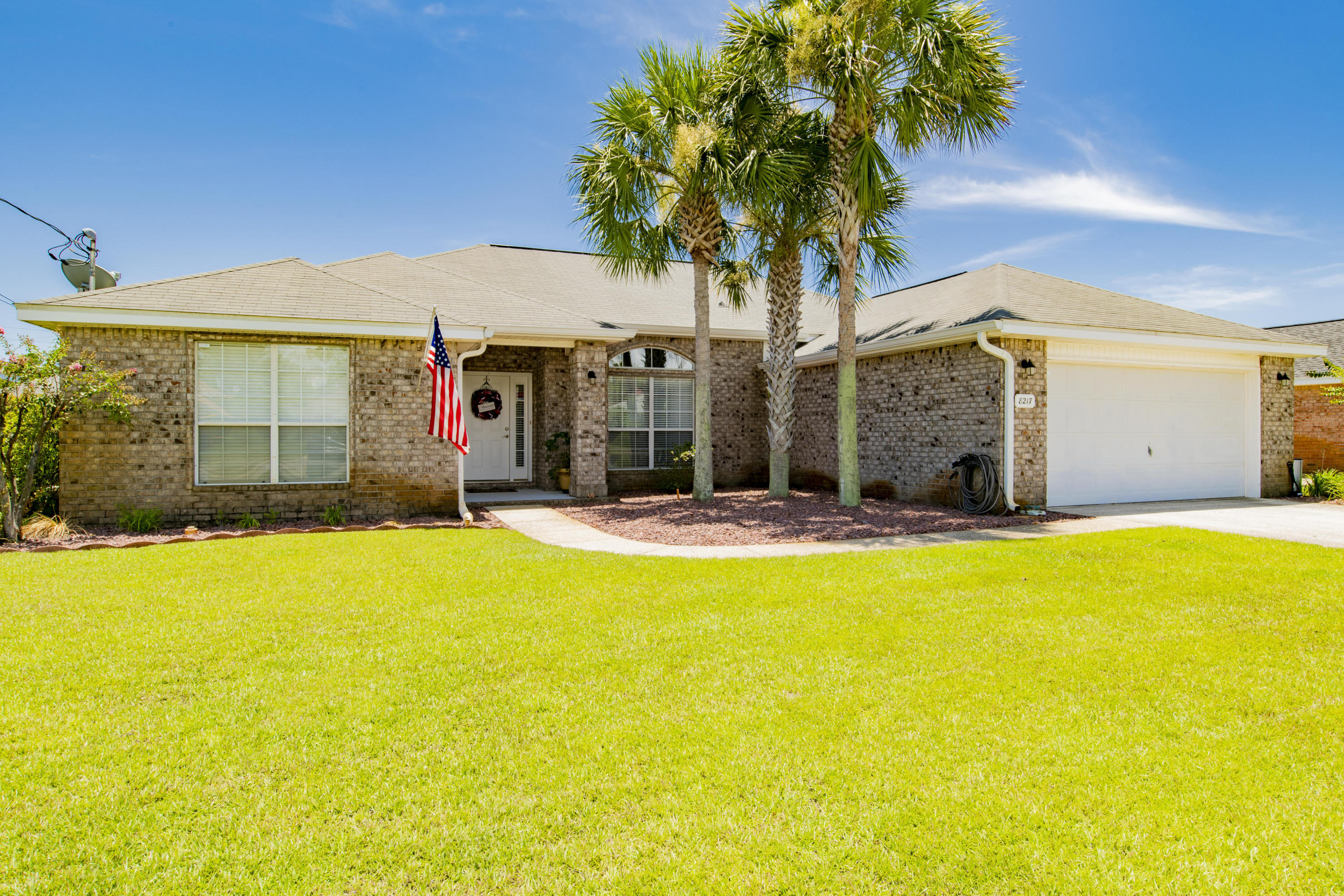 Nestled in the heart of Navarre in the subdivision of Sky Ridge Estates, this well maintained 4 bedroom 2 bathroom has so many wonderful features! Upon entering, you'll note the high ceilings and tile flooring throughout the main living area and kitchen. You'll enjoy the separate formal dining area and open spacious floor plan. The kitchen comes equipped with granite counter tops, built-in desk, island, large breakfast nook, ample storage in cabinets, pantry and sizable bar top perfect for entertaining. This home features a split floor plan allowing privacy for the master suite. The master suite has 2 walk-in closets and the bathroom has just been renovated with a brand new custom tile walk-in shower, garden tub, Quartz countertops, new flooring, professionally painted cabinetry, vessel si nks, hardware and fixtures. The 3 additional bedrooms are located on the opposite side of the home and share the second bathroom. Other notables are blinds and updated light fixtures throughout the home, additional storage in laundry room, new Paella sliding glass door, water and ice dispenser in fridge, fully fenced back yard, sprinkler system and gutters. This home has a termite bond. No HOA. Enjoy the public boat ramp on Navarre Beach only 3 miles away! 3 miles to Publix and more shopping. 11 Miles to Hurlburt Field. This is a wonderful location! Check out our full video tour on the MLS and YouTube!