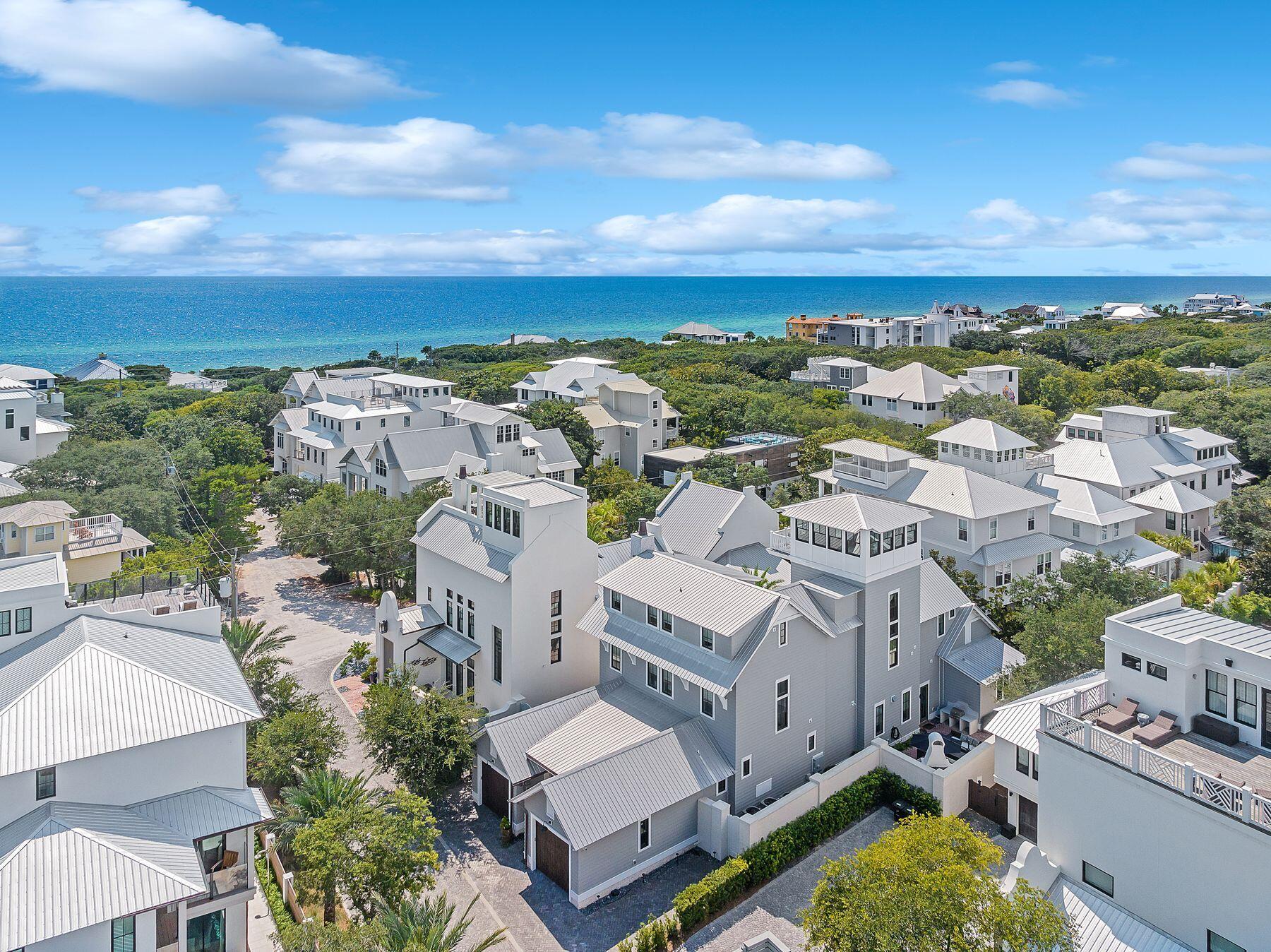 Nestled in the charming neighborhood of Old Seagrove, this exceptional custom home is a true testament to craftsmanship and design. It spans an impressive four levels, featuring five spacious bedrooms, each thoughtfully equipped with its own ensuite bathroom. Evening gulf views from the top-floor tower complete a wonderful day. As you step into the foyer and enter the main level of this exquisite home, you are immediately immersed in the artistry of custom trim and millwork, meticulously crafted from rare black cypress found rarely in homes here on 30a. 

Throughout the residence, six-inch white oak plank flooring creates a timeless backdrop, seamlessly connecting all of the living spaces. The heart of the home is found in the kitchen, living and dining space and the transition from indoor to outdoor living is effortlessly achieved with floor-to-ceiling NanaWalls. The gourmet kitchen boasts top-of-the-line amenities and custom pecky cypress cabinetry accented with elegant glass inlays. For effortless entertaining, a well-appointed wet bar is positioned off the kitchen. Convenience is key on the first level, which also features a mudroom with direct access to a second courtyard, complete with a summer kitchen and a gas fireplace.

The primary suite features cathedral-style ceilings crafted entirely from cypress. The spa-like ensuite bathroom showcases Carrara marble floors and showers, a theme that is echoed throughout all of the home's bathrooms. The second level offers a private balcony and three additional bedrooms, each accompanied by its own ensuite bath, ensuring comfort and privacy for guests. A second wet bar, additional laundry space and a cozy sitting room enhance this floor's conveniences. The third floor presents the ultimate children's suite, beginning with bunk beds crafted from black cypress. A generously sized bunk room awaits with four additional queen-over-queen bunks. This floor also features its own elegant bathroom suite with double vanities and an oversized shower. 

The fourth-floor tower sits above the canopy of Old Seagrove, offering panoramic views of the Gulf of Mexico. This level is designed for enjoyment with a well-appointed wet bar, complete with a wine refrigerator, making it effortless to entertain family and friends while relishing in the splendor of Gulf Coast sunsets.
