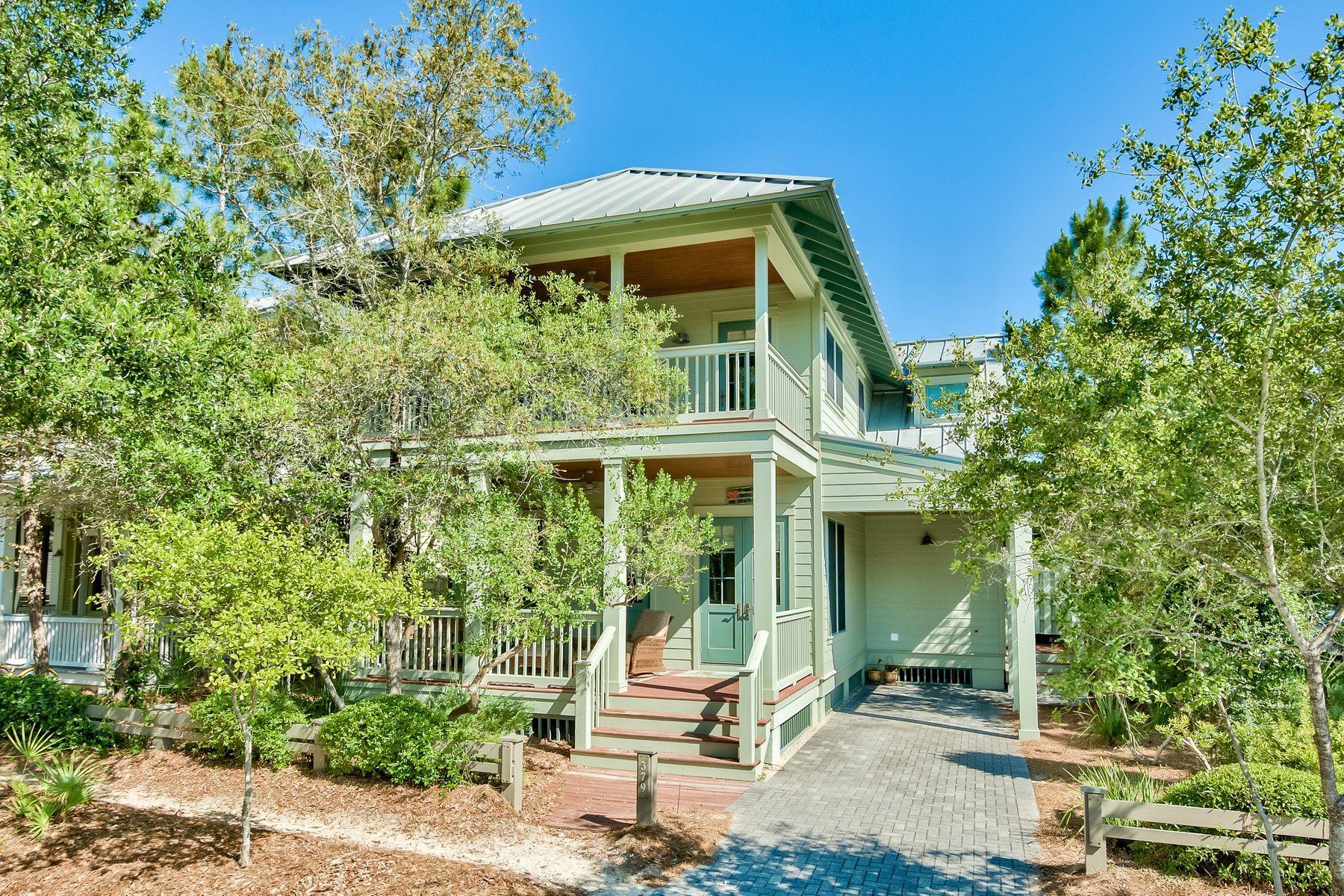 Enviably located overlooking the pond at Camp Watercolor, this four-bedroom, four-bath home has the high-quality build and amenities that define this active community. Ideal as a fun-filled single-family home or as a lucrative vacation rental, it comes fully furnished and includes a built-in bunk room. Coffered ceilings, spa bathrooms, a summer kitchen and wrap around deck are just some of the surprises in store. Wood floors create a seamless flow through the open-plan living room and kitchen with its superior fitments, island cooking station and soapstone-smooth granite counters. The adjoining dining area with built-in buffet is perfect for leisurely breakfasts or entertaining. Two master suites, one on each floor, negate the need for compromise. The upstairs master suite doubles as a private sitting room with lofty ceiling and comfy armchairs arranged around the fireplace and wall-mounted TV.  French doors lead to a screened porch with serene pond views and further private space for quiet reading amid the lacy green treetops. What sets any WaterColor home above the rest are the outstanding amenities with new expansions to the Beach Club and Camp WaterColor. Bicycle along trails to Town Center or WaterColor Workout or launch complimentary kayaks and paddle boards and explore Western Lake. If you seek relaxation in the sun, the Beach Club has everything you need including towels, beach chair set-up, pools and a beautiful restaurant with gulf views. When you live at WaterColor, you'll always feel like you're on vacation. Camp WaterColor has three heated pools with lifeguards. Zip down the Monarch slide into the Butterfly Pool, play basketball or take it easy on the Lazy River, all just steps from your beautiful new home.