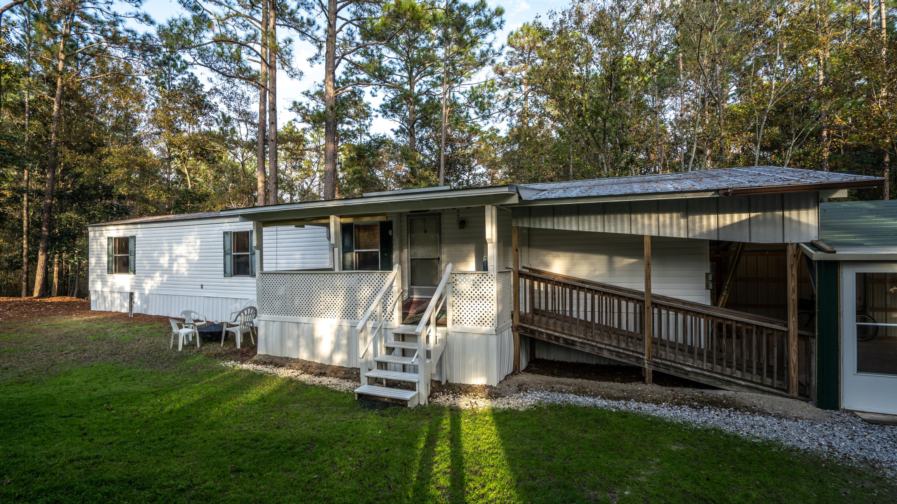 Pride of Ownership Shines Through in this Meticulously kept property with so many recent upgrades made inside and out to make it highly desirable, and a great value in today's market! Add to that all Furniture and Appliances conveying within the home to make moving in a ''Carefree & Turnkey'' experience. Located in a Peaceful Creekside Setting and having easy access to Hwy 98, 30A, The Beach, & Cessna Landing Boat Launch and Park. Click on the photos to discover the many extras like the beautifully built Carport and Workshop, the Children's Play Area & Swings, and the Covered Front & Back Porch. Inside, experience the warmth of an outstanding natural light level accented by beautiful new window blinds. Come see it today, make it yours, and love it forever!