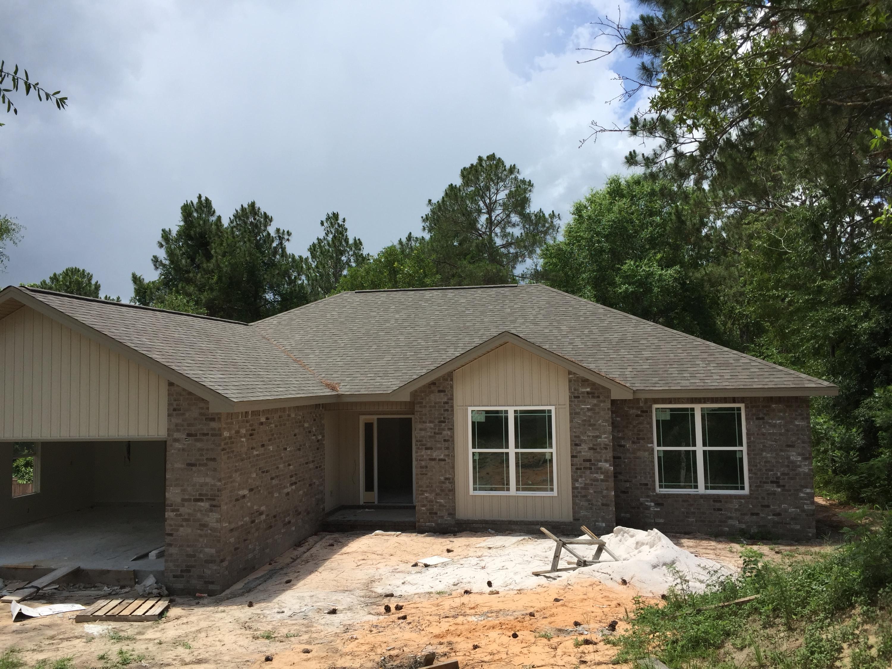 Wonderful semi-custom home south of I-10 in Crestview. This four bedroom home has lots of space for that growing family. Home overlooks a wooded natural area giving you privacy while relaxing on your back porch. Solid wood cabinets, granite tops and all electric appliances makes cooking in this kitchen a dream. Great price on this home so it won't last long!